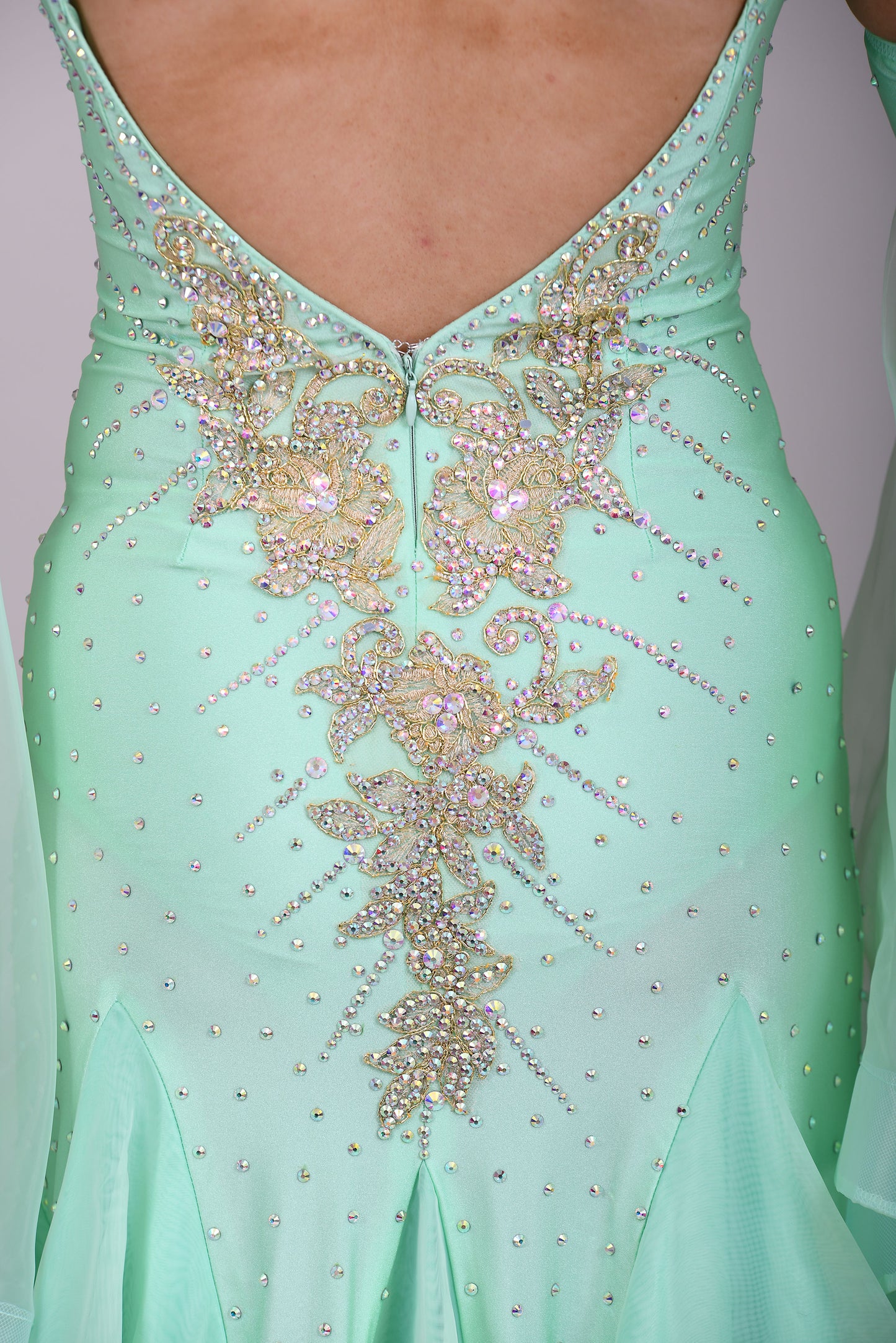 327 mint Green & Gold Ballroom Dress. Decorated with Gold motifs & AB Stones. Comes with separate floaty sleeve cuffs.