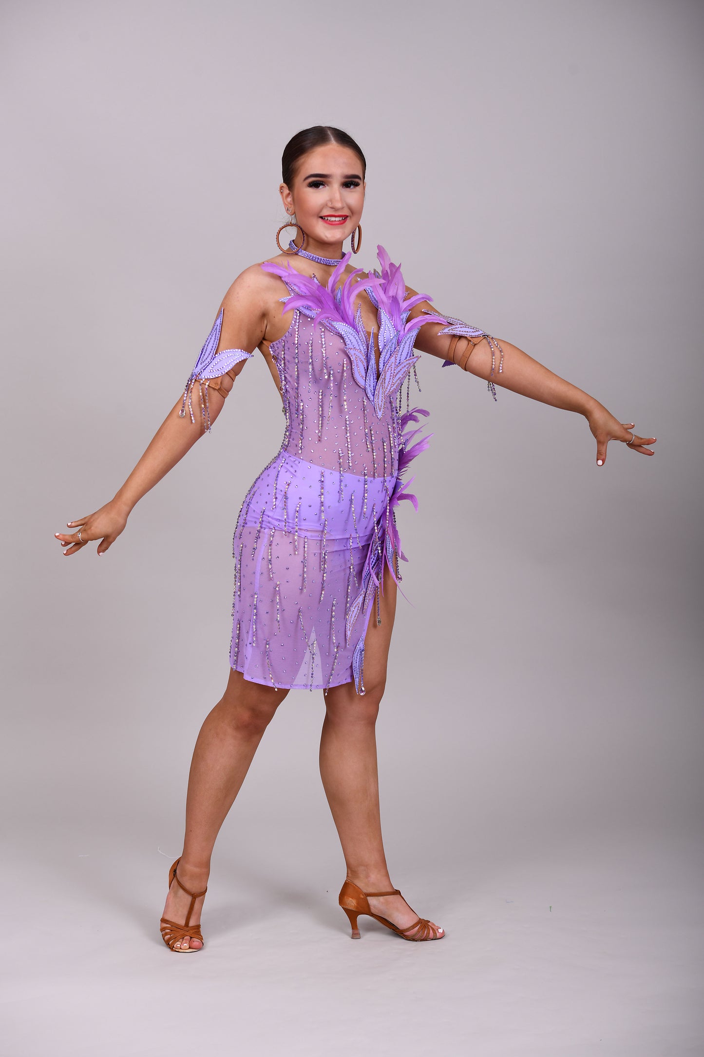 160 Lilac Latin dance dress. Stunning feather detailing to the upper chest & hip. Mesh fabric dress.
