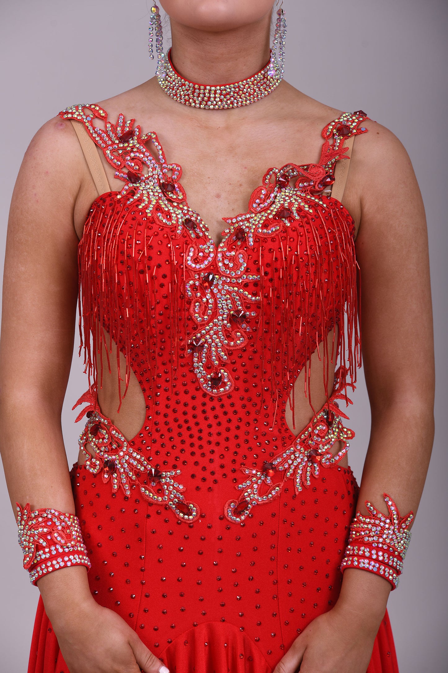 206 Red Lycra Dress with super full skirts. Motif detailing to back. Decorated with Siam bead droppers, cut out sides decorated in Siam & AB stones