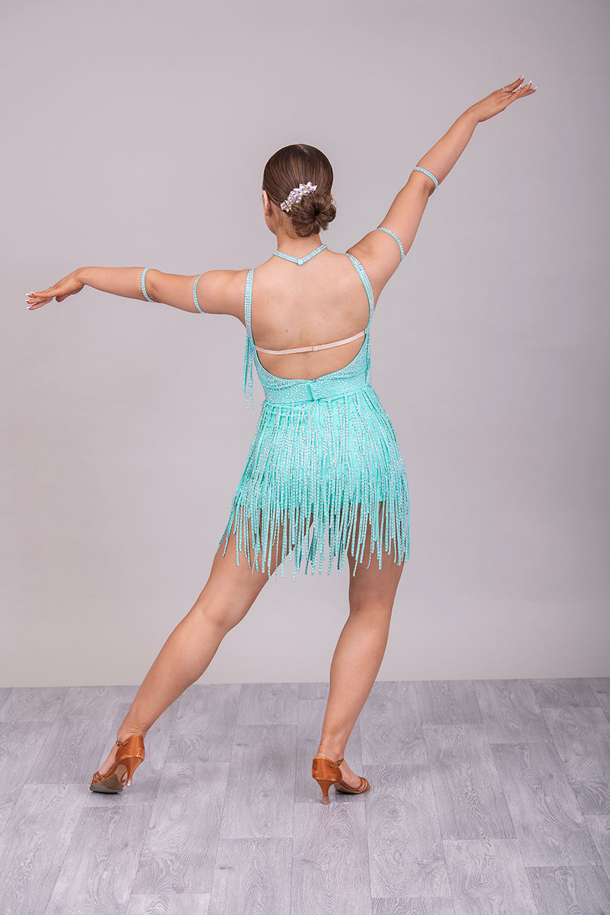 23L Mint Green Latin/Rhythm Competition Dance Dress. Heavily stoned in AB with optional Belt. Stoned Fabric strips to the chest area and skirt. Cones with Necklace & Armbands