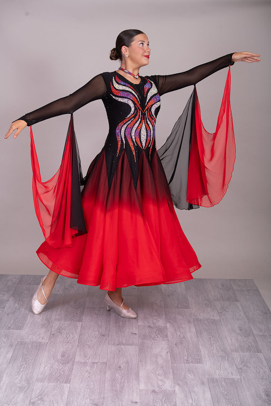 39B Red Black & Orange Ombre Competition Ballroom/Sequence Dance Dress. Ombre stoning in Oranges through to AB. Black & Red Ombre skirts with full back coverage. Detachable Floats complete this beautiful dress