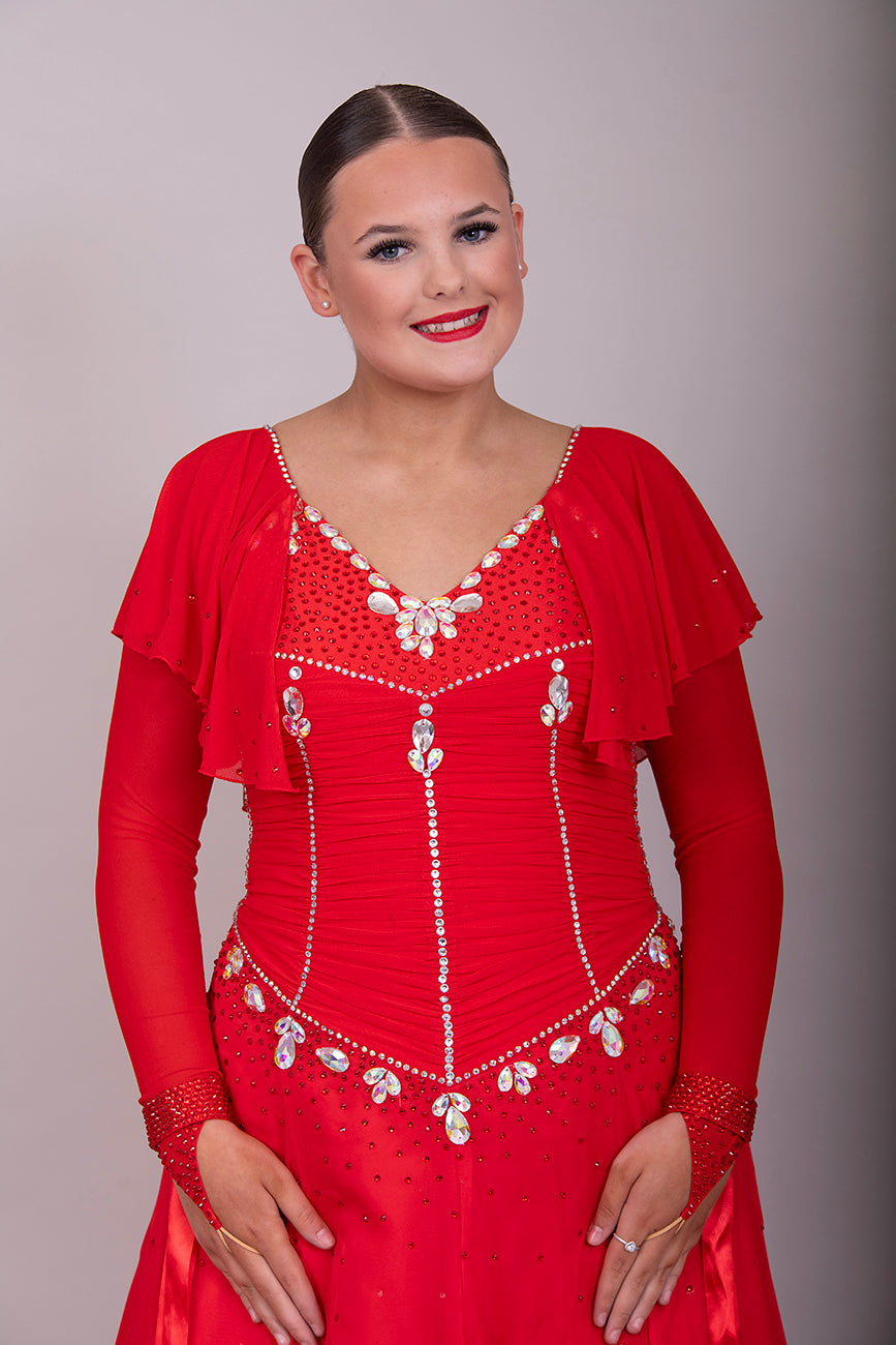 340 Red Rouched Bodice Ballroom Dress. Frill detail to top of sleeve with detachable ribbon floats. Detailed necklace. Decorated in Siam and AB stones.
