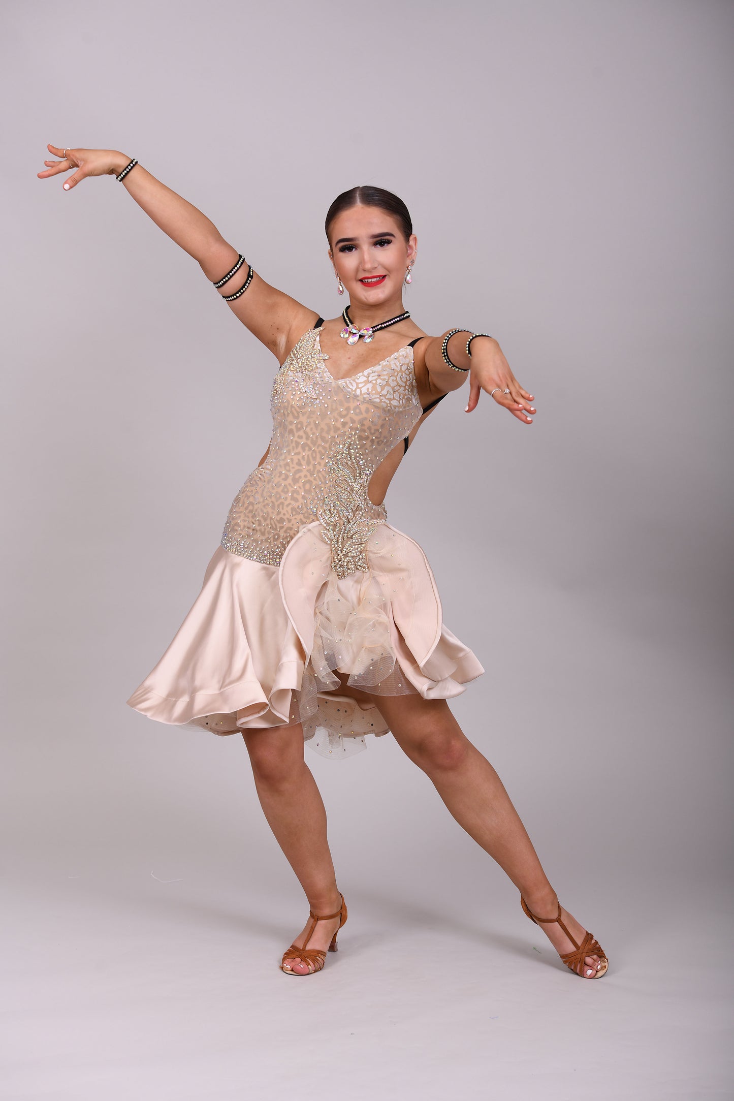 175 Champagne flesh Leopard fabric Latin dress. Soft satin skirt with motif detailing to one hip. Gold appliqué with AB stones