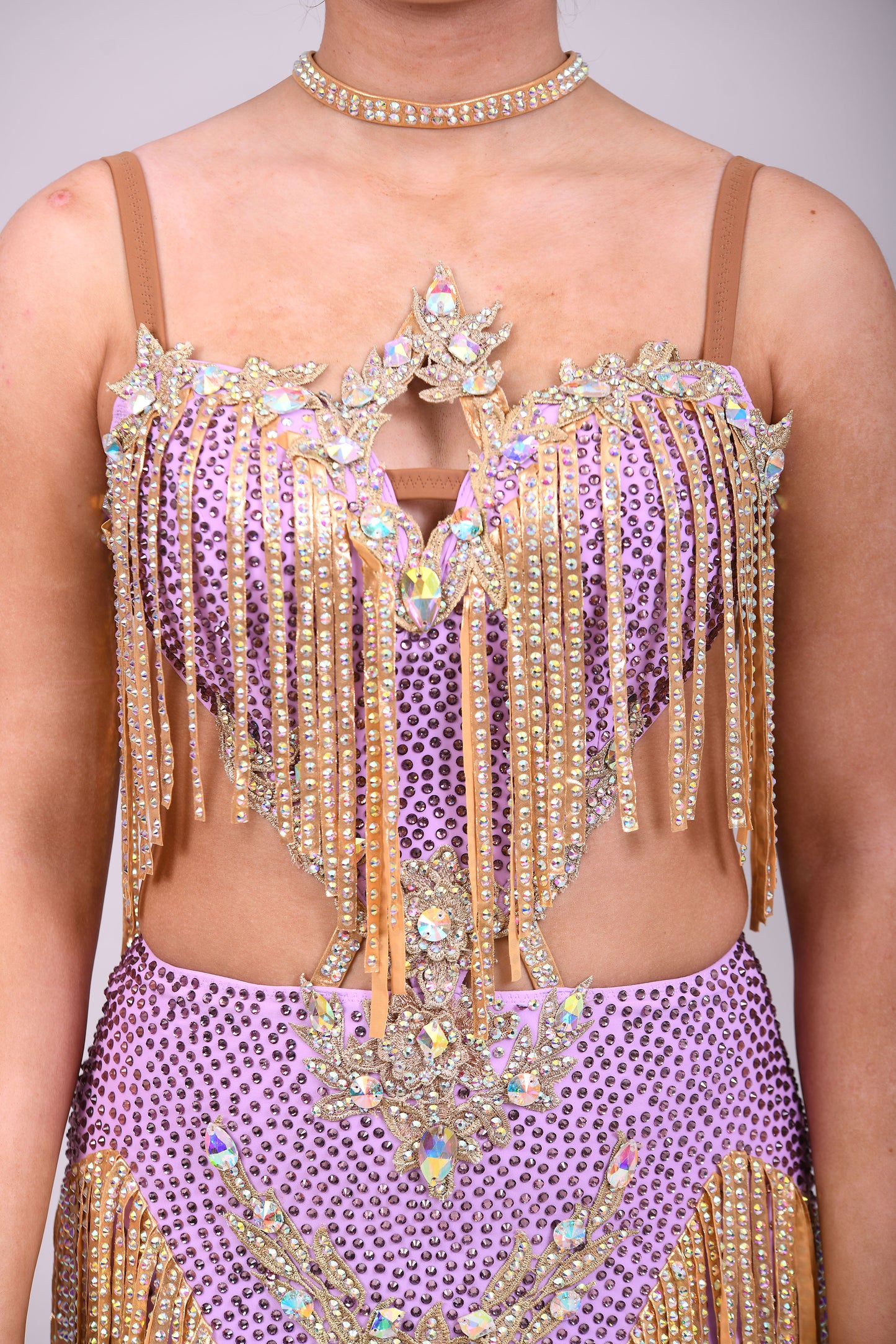 295 Lilac and Gold Latin dress. Gold material droppers stoned in AB. Lilac fabrics all decorated in matching stones.