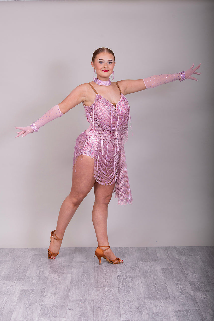 016 Dusky Pink stoned mesh overlay Latin Dress. Stoned in Light Pink with material droppers stoned. Pale pink appliqués with rose stones.