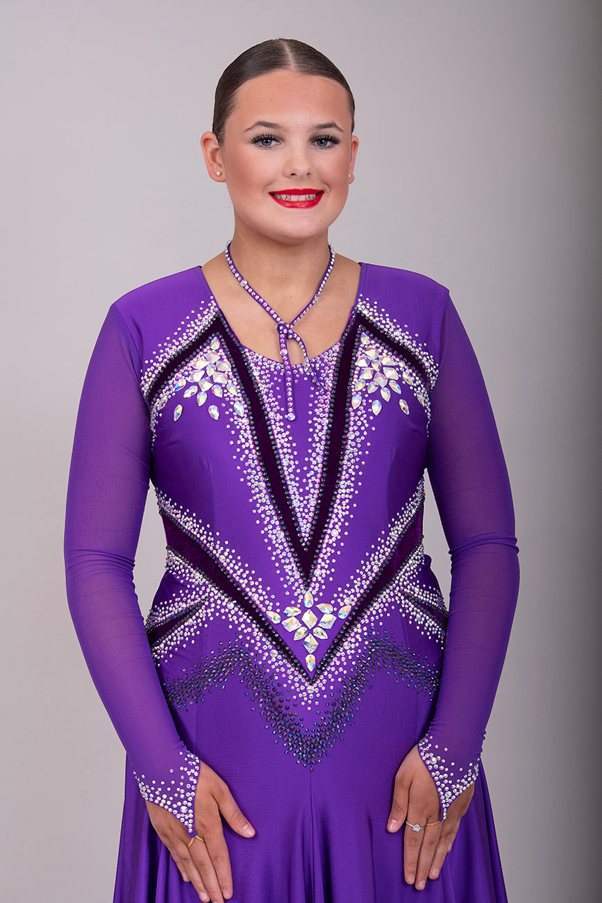 041 Cadbury Purple Competition Latin Dance Dress. Deep purple contrast pattern heavily stoned in AB & Amethyst AB. Bold & Flattering design. Full skirt giving maximum movement.