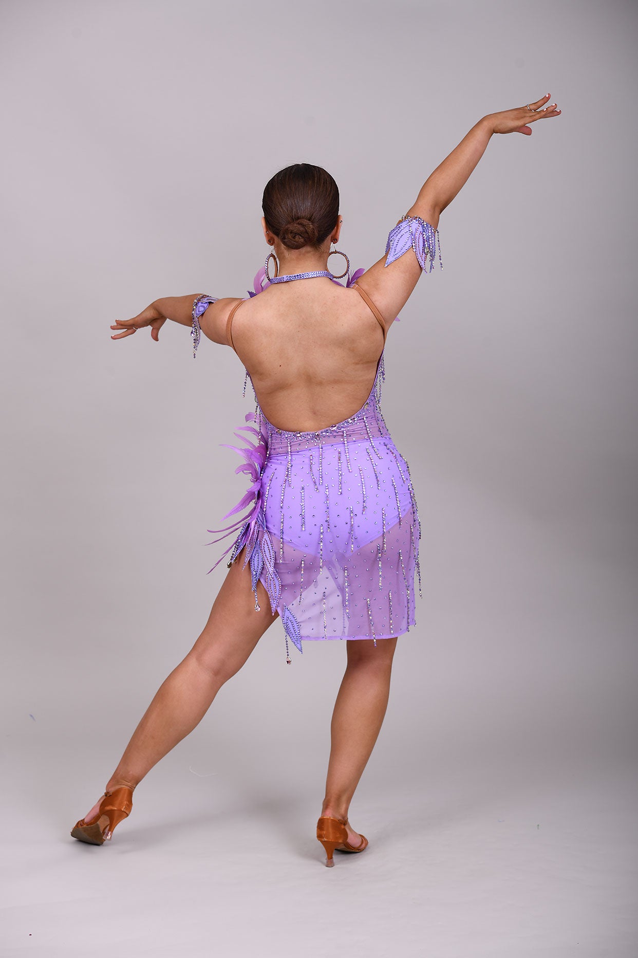 160 Lilac Latin dance dress. Stunning feather detailing to the upper chest & hip. Mesh fabric dress.