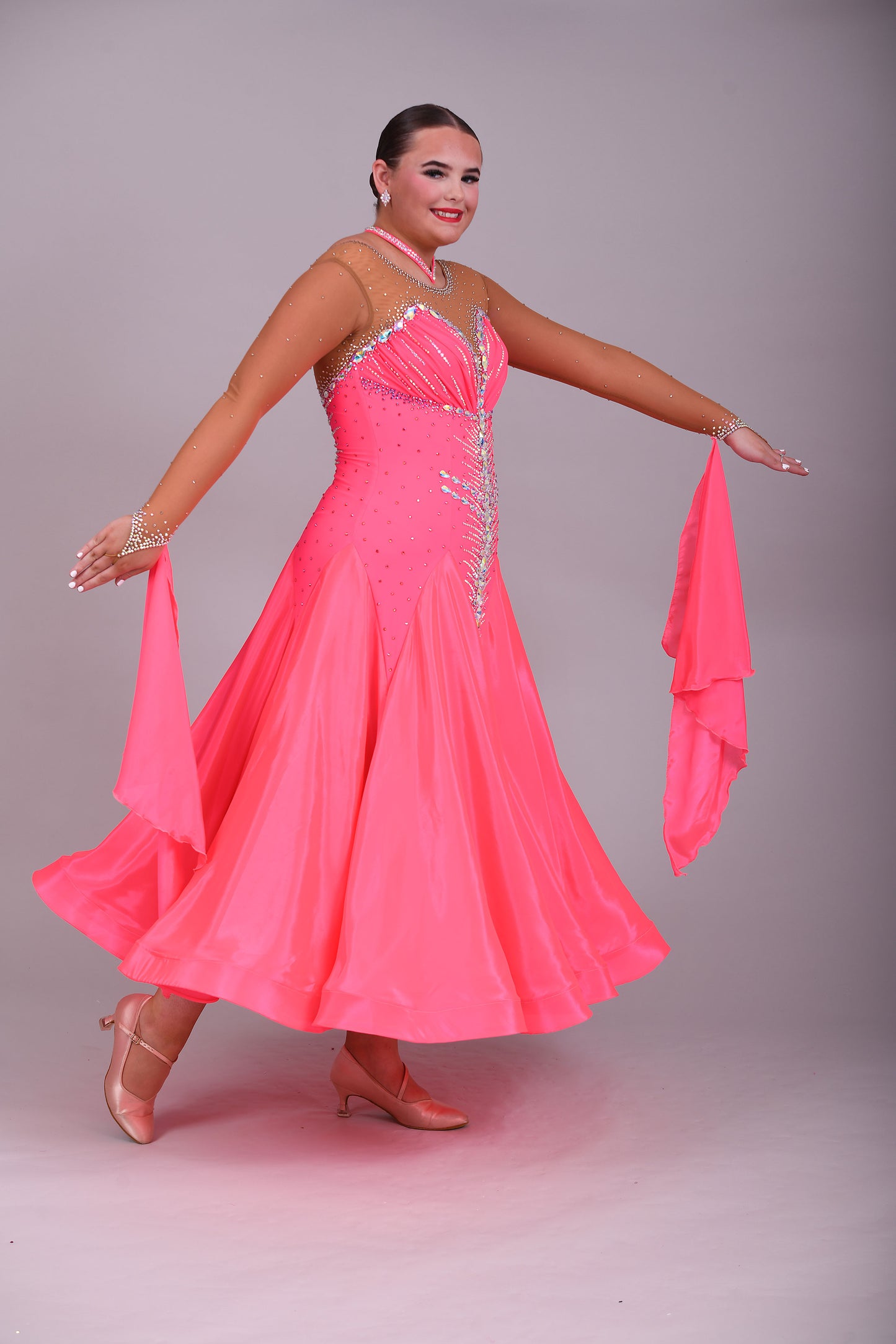004 Coral Competition Ballroom Dance Dress. Heavily stoned in AB, pink AB & Golden Shadow. Strapping detail to the back. Comes with detachable floats.