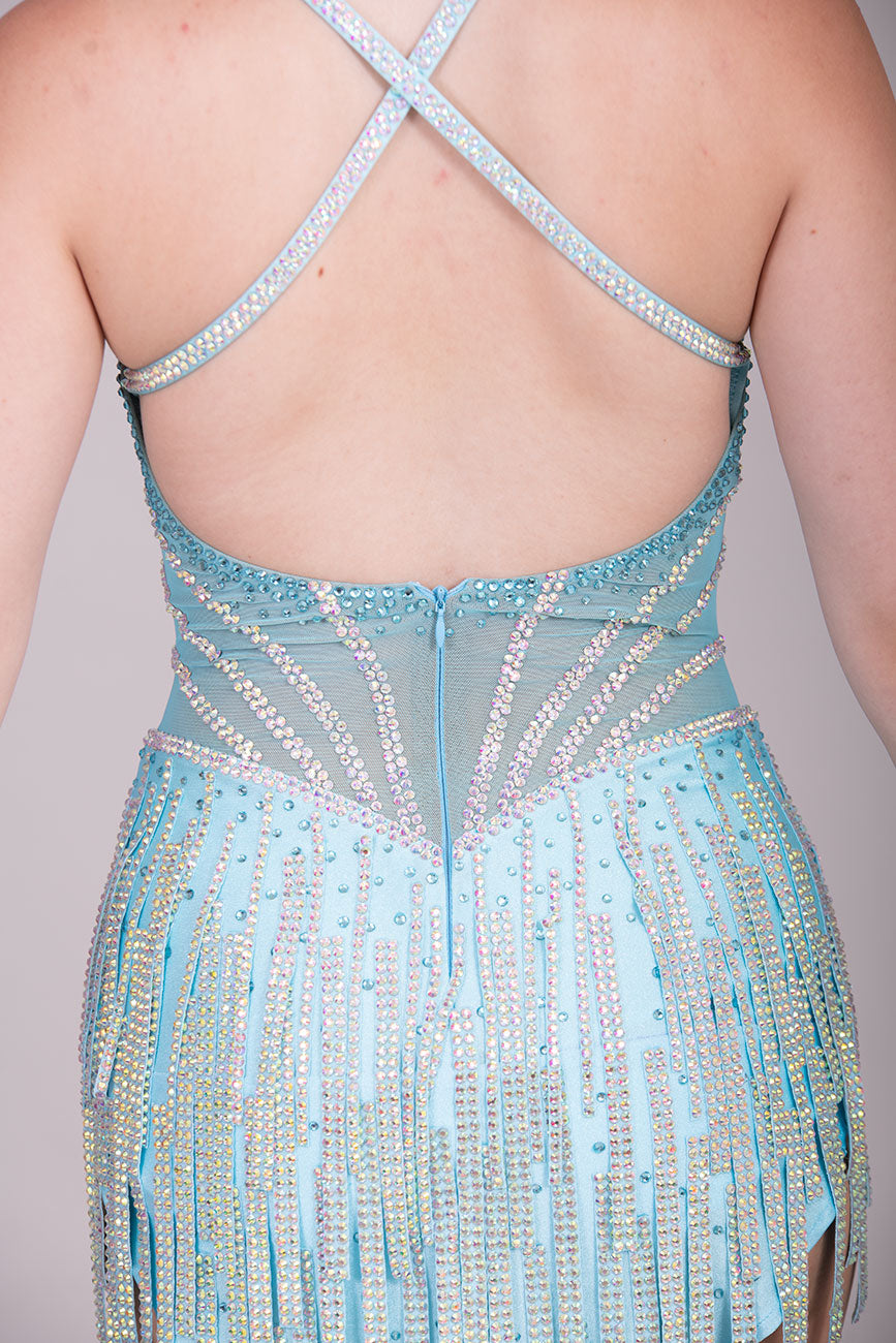 30L Standout Pale Aqua Competition Latin Dance dress. Beautiful front detailing with Aqua mesh centre with corset effect stoning. Heavy stoned fabric tassels to the skirt. Crossover strapping on the back.