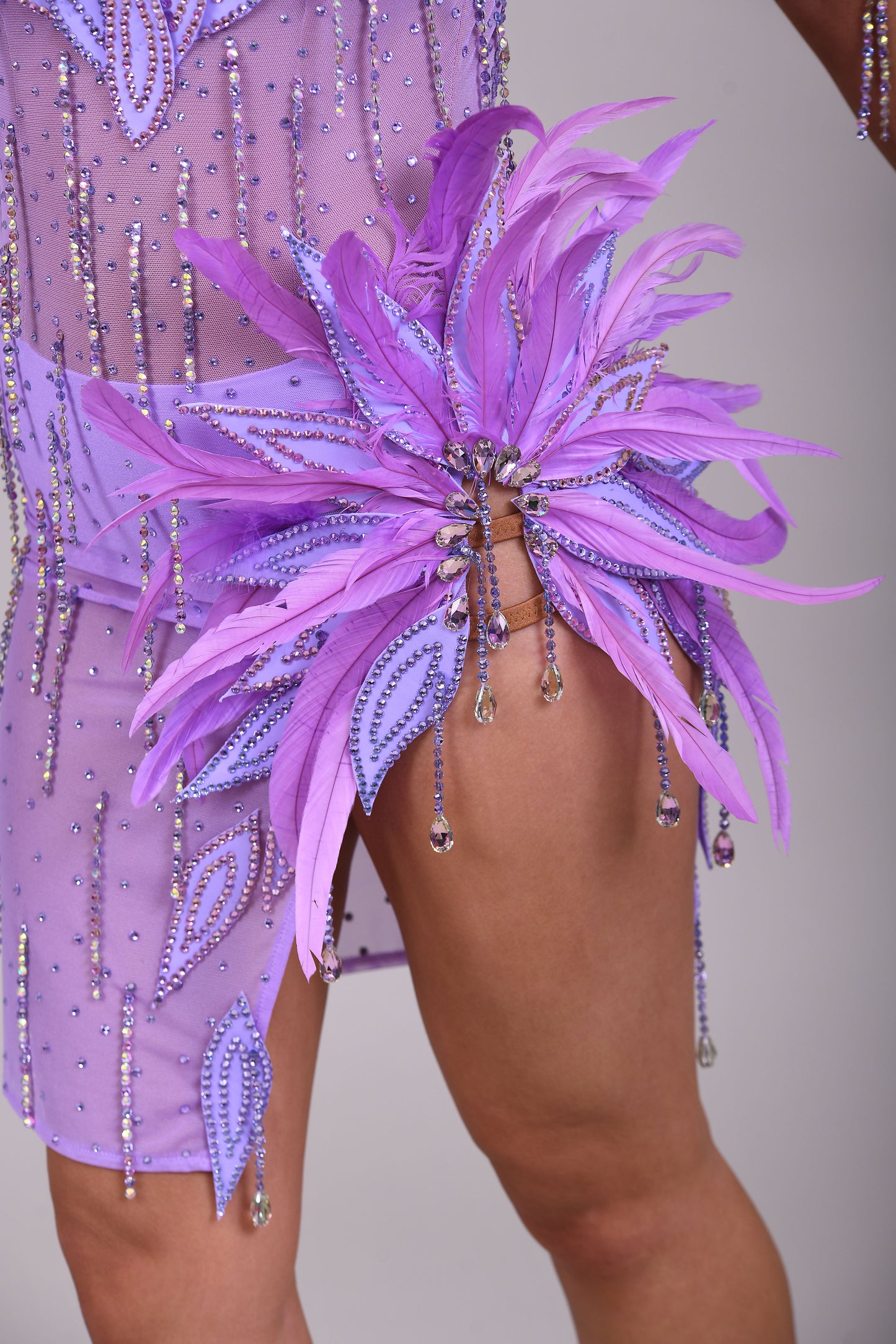 160 Lilac Latin dance dress. Stunning feather detailing to the upper chest & hip. Mesh fabric dress.
