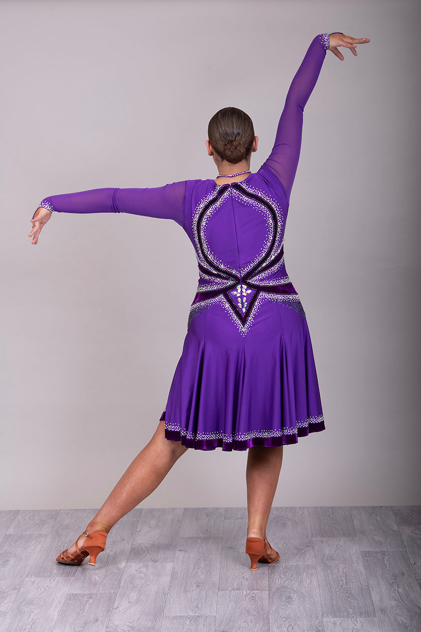 041 Cadbury Purple Competition Latin Dance Dress. Deep purple contrast pattern heavily stoned in AB & Amethyst AB. Bold & Flattering design. Full skirt giving maximum movement.
