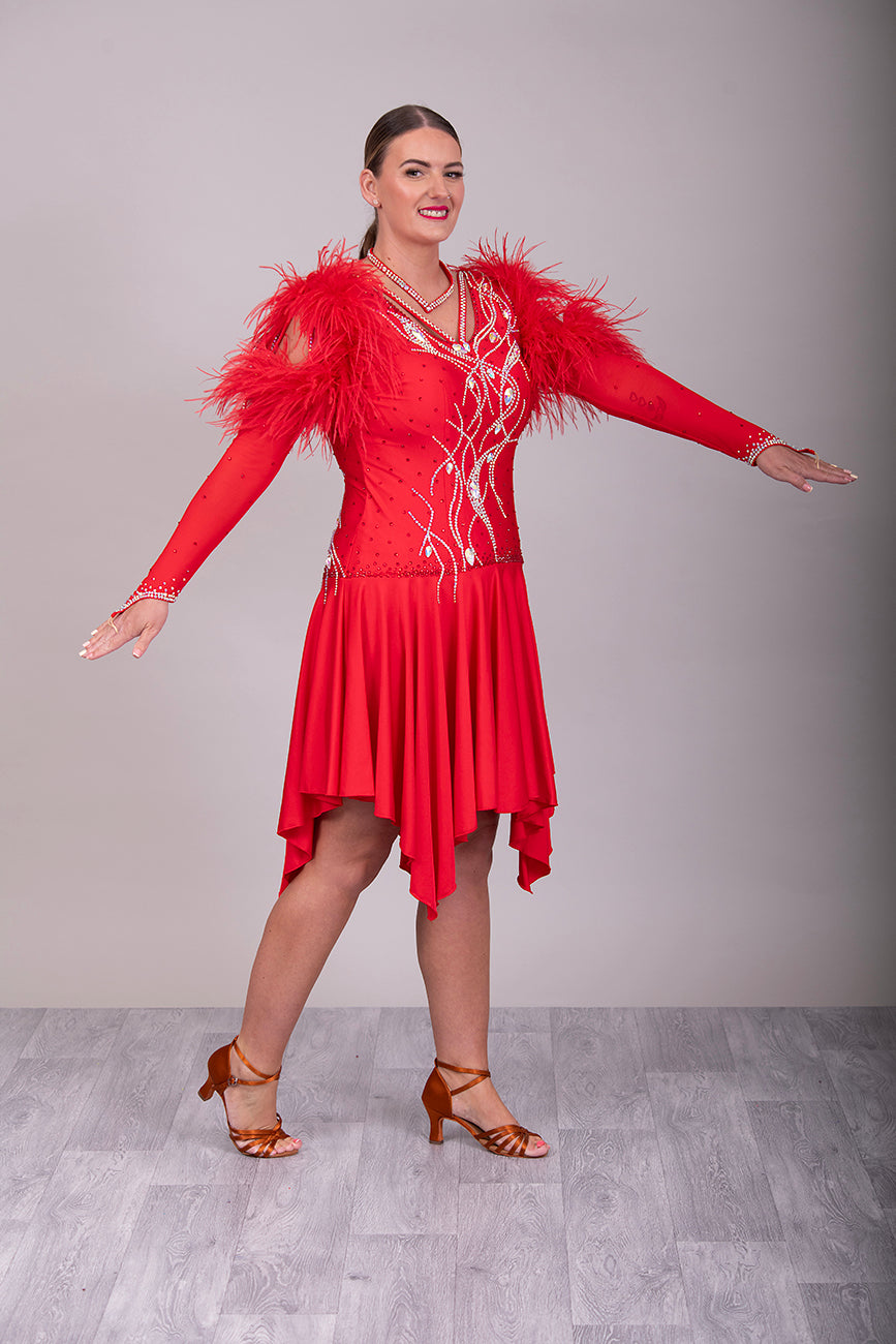 301 Rich Red Competition Latin Dance Dress. Ostrich boa decoration to the upper arm with stoned strap detail. Very full skirt. Stoned in Light Siam & AB