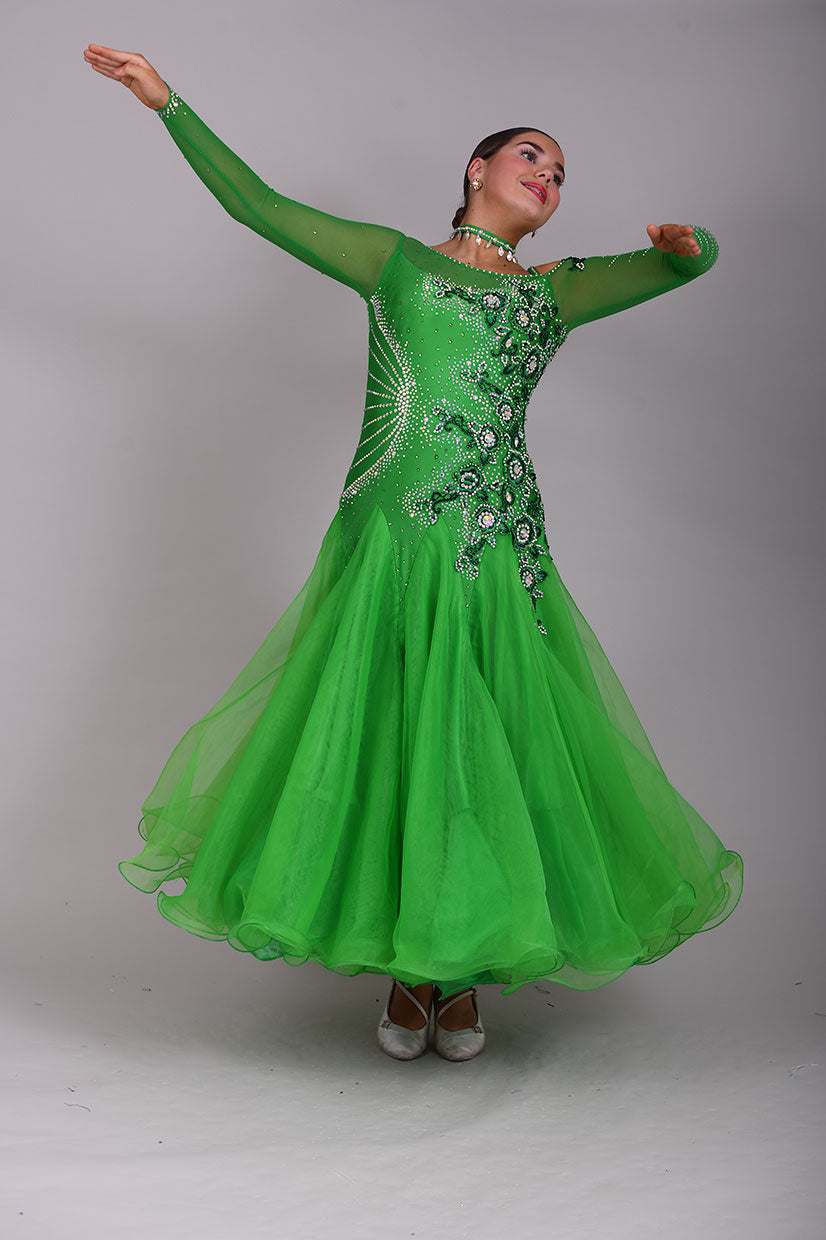 010 Apple Green one Shoulder, one cold shoulder Ballroom Dress. Appliqué stoned in AB & Jade to one side of the bodice.