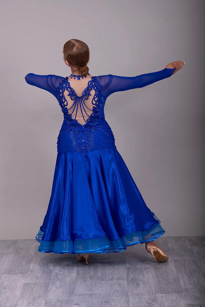 339 Bright Royal Blue Ballroom Dress. Stunning detailing to the back with Strappy detail to the hips. Organza edged in ribbon. All stoned in Bright Royal Blue. Very comfortable Front Zip fastening.