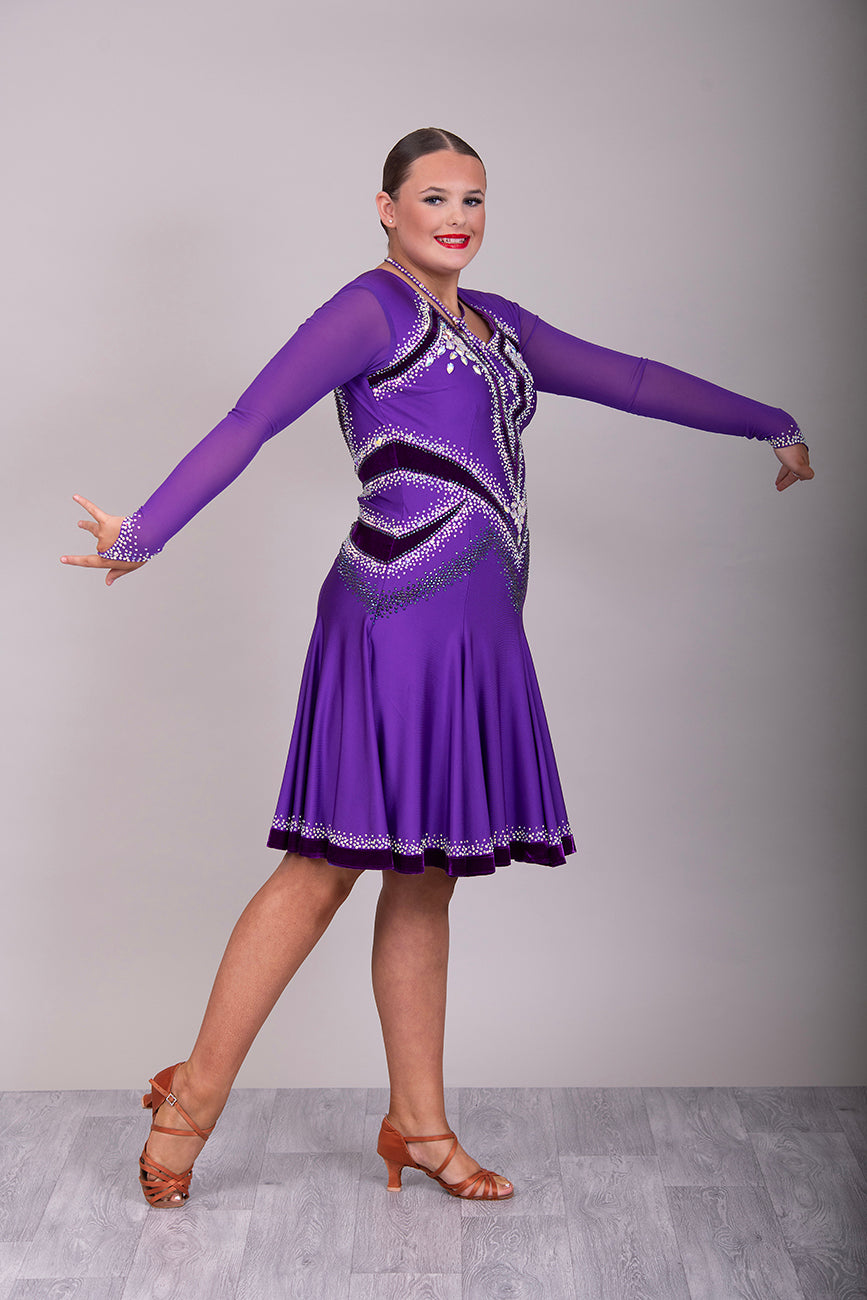 041 Cadbury Purple Competition Latin Dance Dress. Deep purple contrast pattern heavily stoned in AB & Amethyst AB. Bold & Flattering design. Full skirt giving maximum movement.