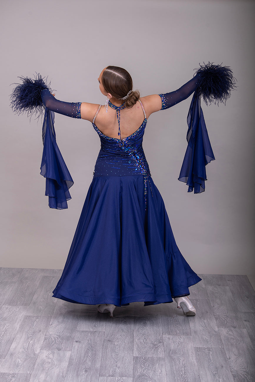 07B Navy Blue Ballroom/Sequence Competition Dance Dress. Stunning Bodice Detail stoned in Sapphire, Capri Blue, Capri Blue AB & Sapphire AB. Cones with Gloves & Ostrich feather cuffs with hanging floats.