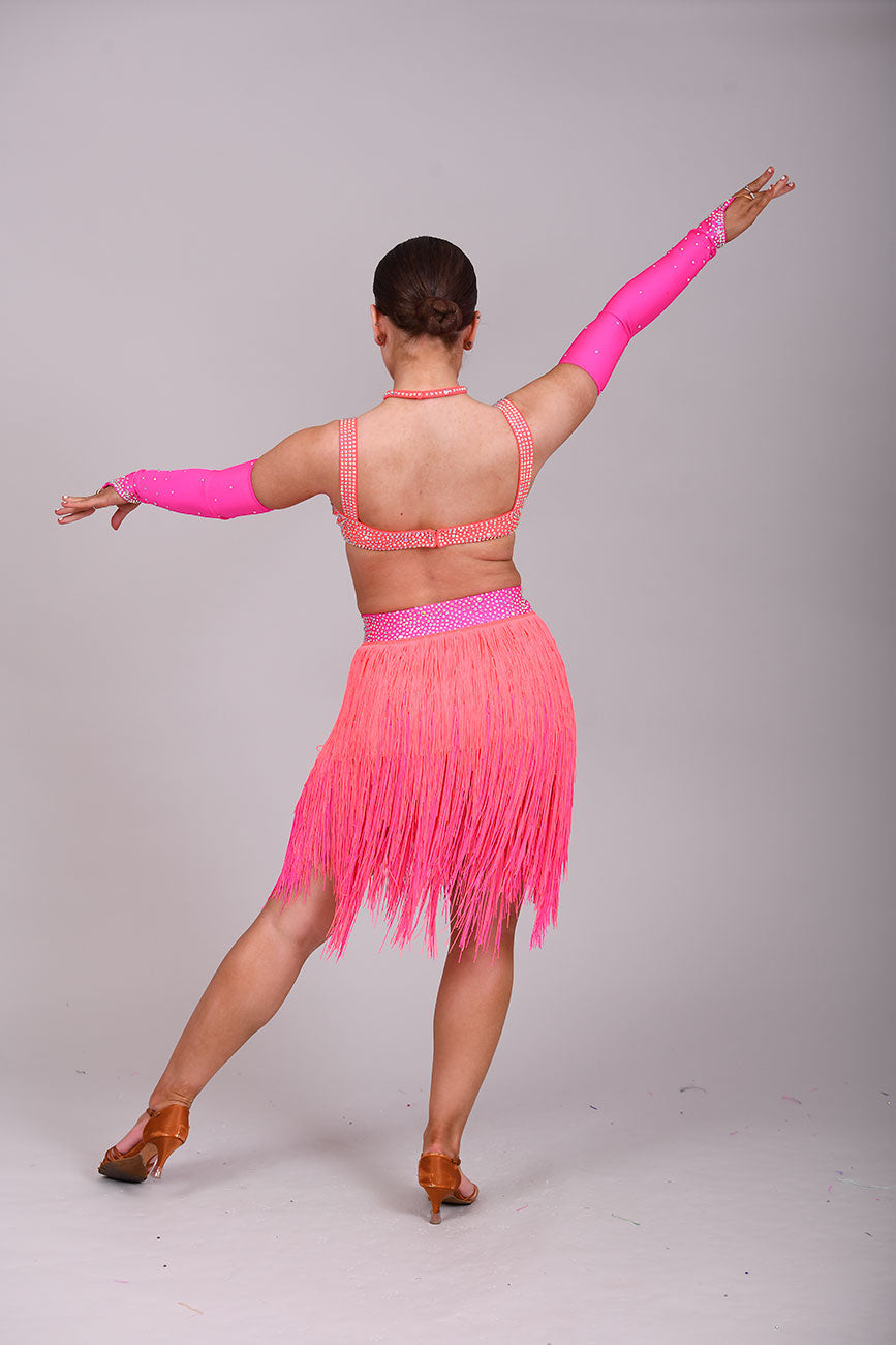 153 Flo Pink & Flo Orange Latin Dance Dress 2 Piece. Comes with separate gloves. Heavily stoned in AB with belt detail to the skirt