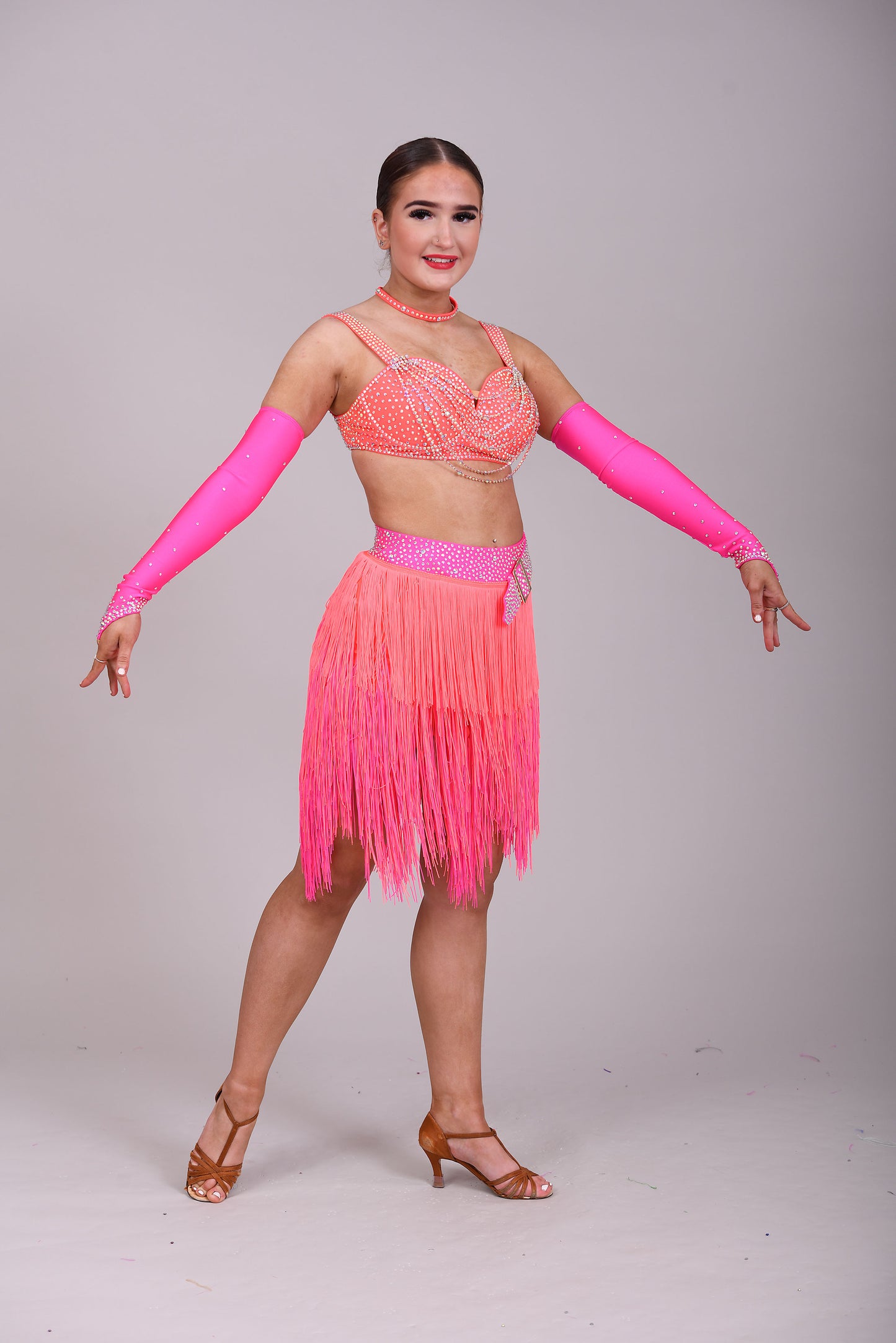 153 Flo Pink & Flo Orange Latin Dance Dress 2 Piece. Comes with separate gloves. Heavily stoned in AB with belt detail to the skirt