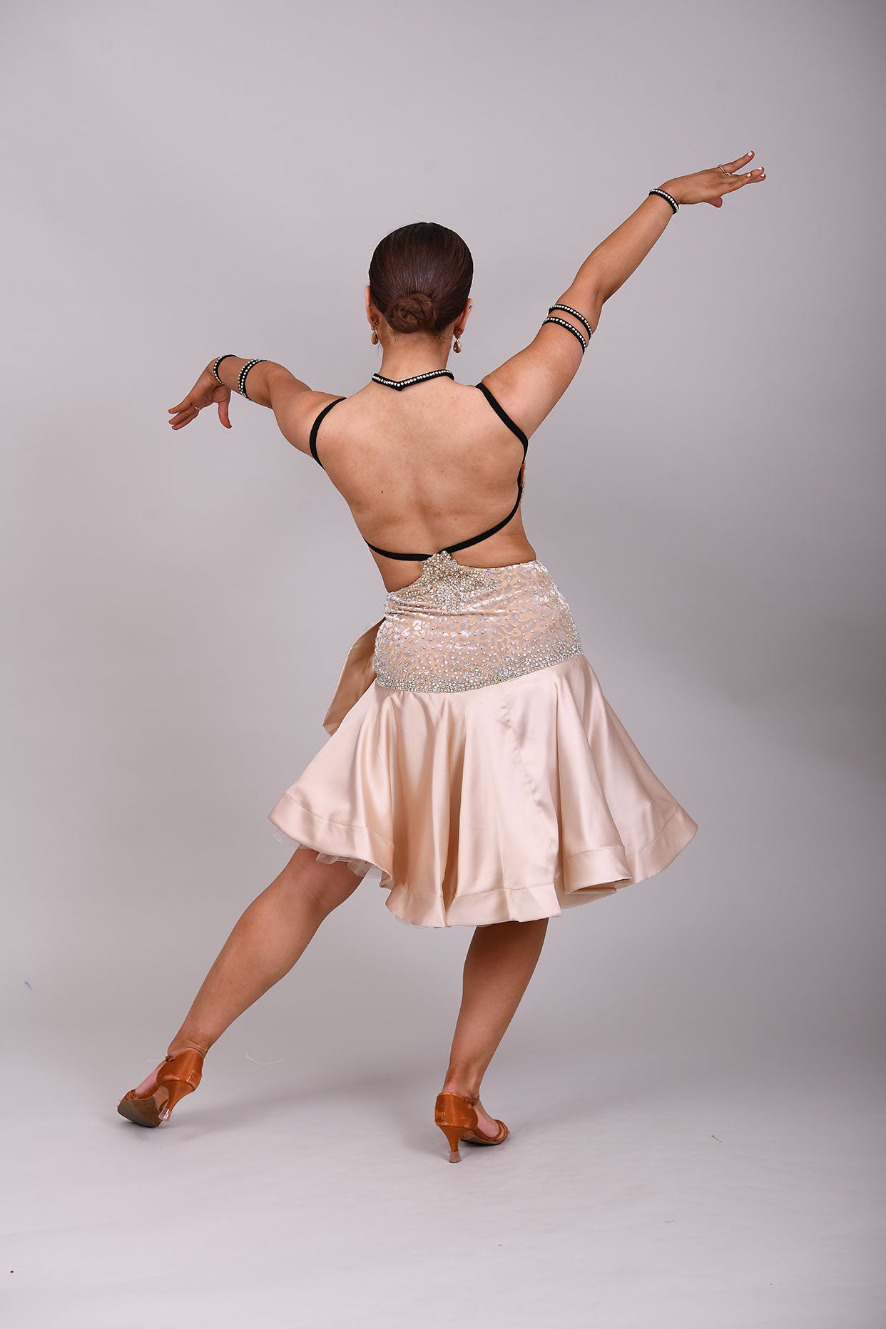 175 Champagne flesh Leopard fabric Latin dress. Soft satin skirt with motif detailing to one hip. Gold appliqué with AB stones