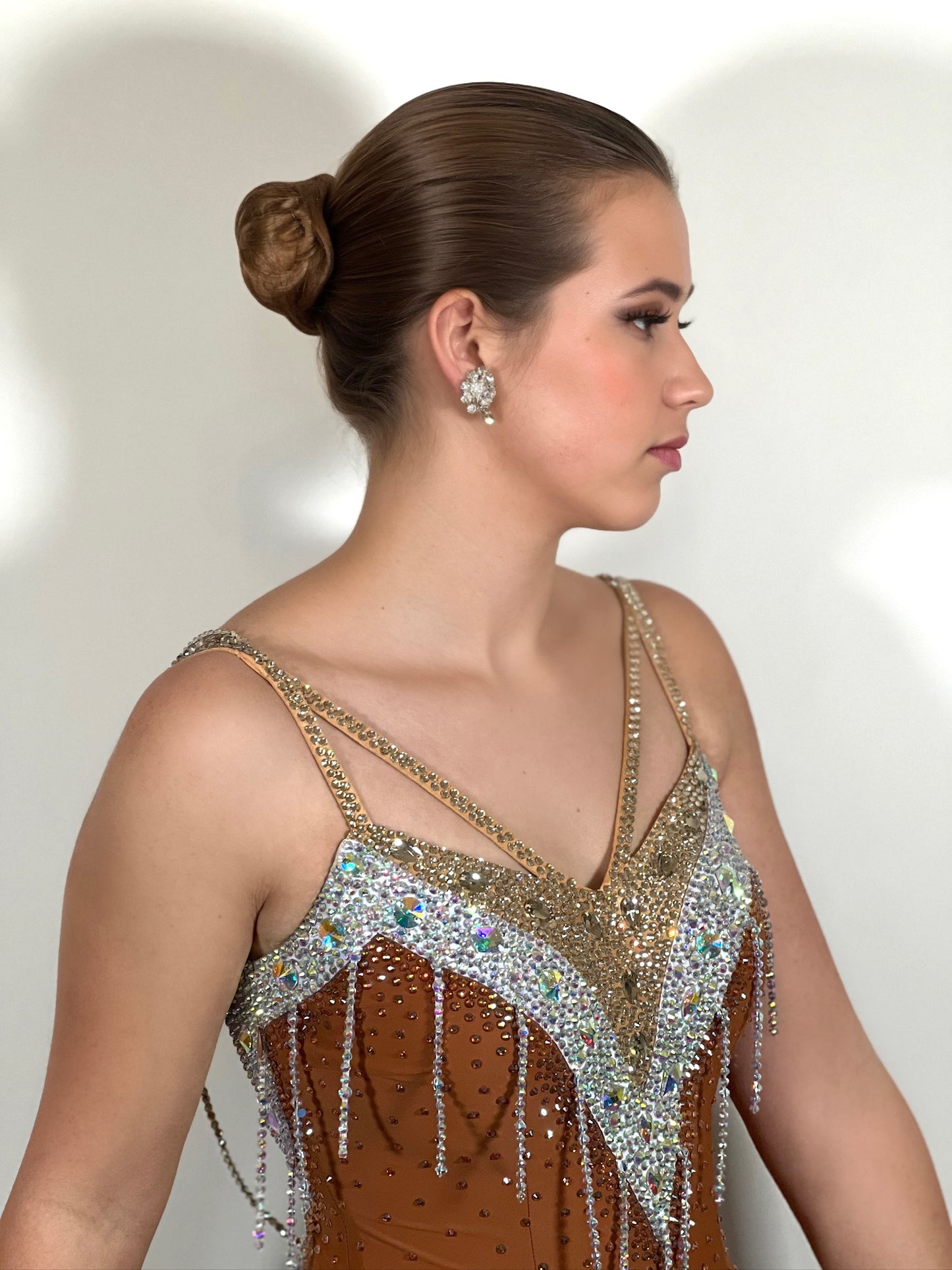 246 Cappuccino Ballroom Dress. Comes with Gloves & detachable glove floats. Stoned in Aurum, Sunshine, Smoked Topaz & Topaz. Strap feature to the back & shoulders