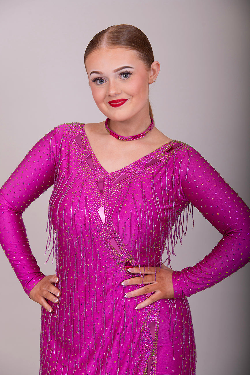 159 Elegant Fuschia Latin Dance Dress. Decorated with Fuchsia mirrors, stones & bead droppers. High back to give option for wearing own bra.