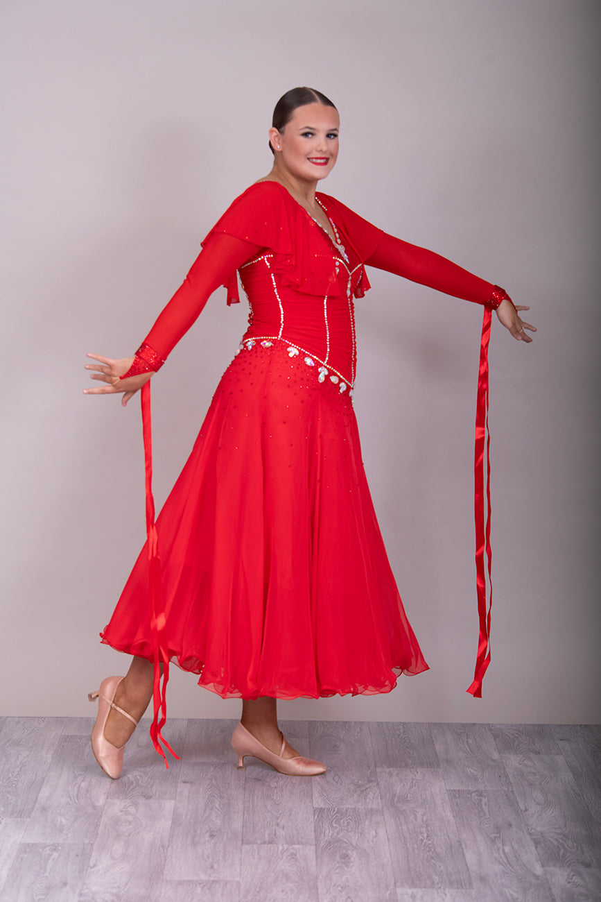 340 Red Rouched Bodice Ballroom Dress. Frill detail to top of sleeve with detachable ribbon floats. Detailed necklace. Decorated in Siam and AB stones.
