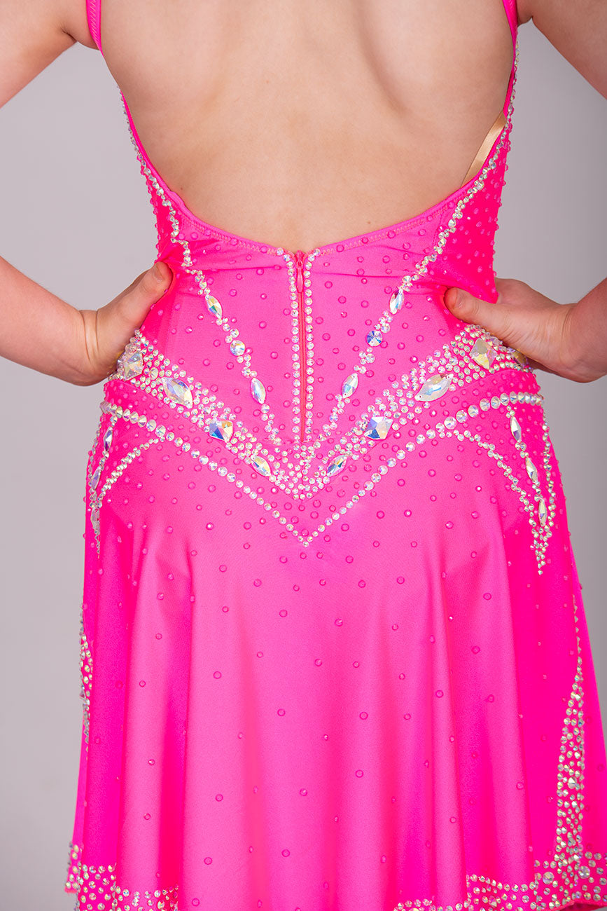 34L Neon Pink Corset style Competition Latin dance dress. Bra cup style bodice with corset effect stoning in AB. Dude splits edged in AB