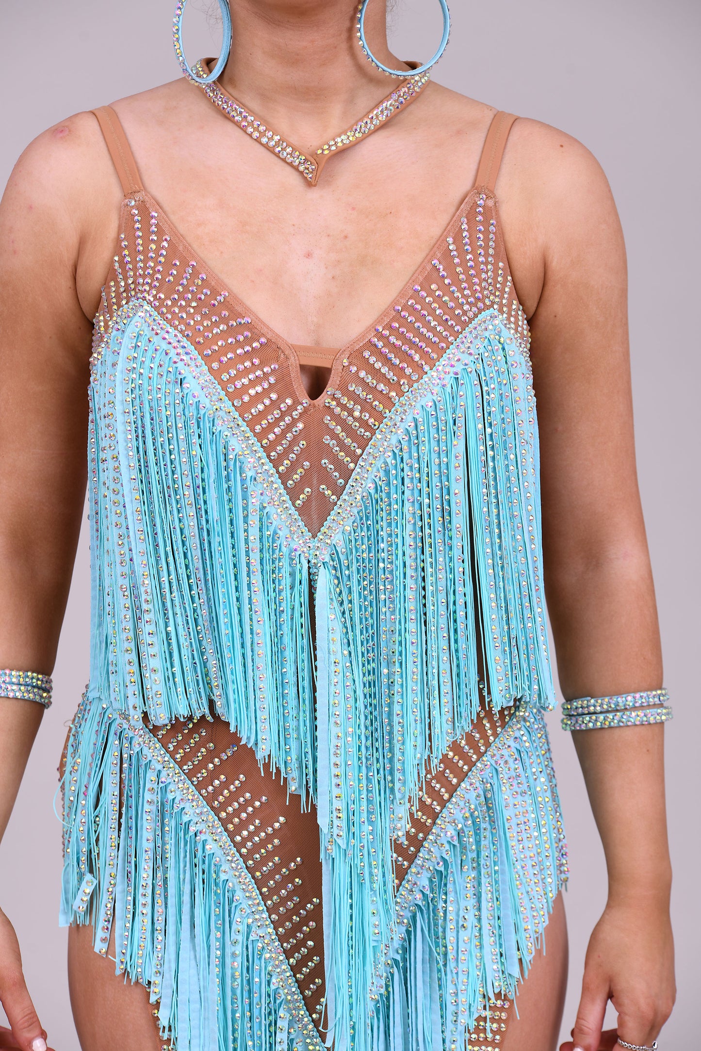 313 Light Aqua and Tan fringe Latin Dress. AB Stones and material stoned droppers.