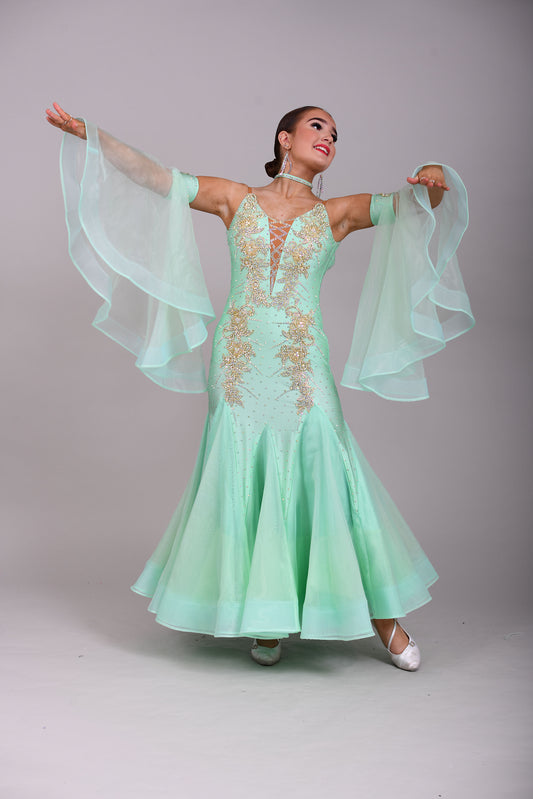 327 mint Green & Gold Ballroom Dress. Decorated with Gold motifs & AB Stones. Comes with separate floaty sleeve cuffs.