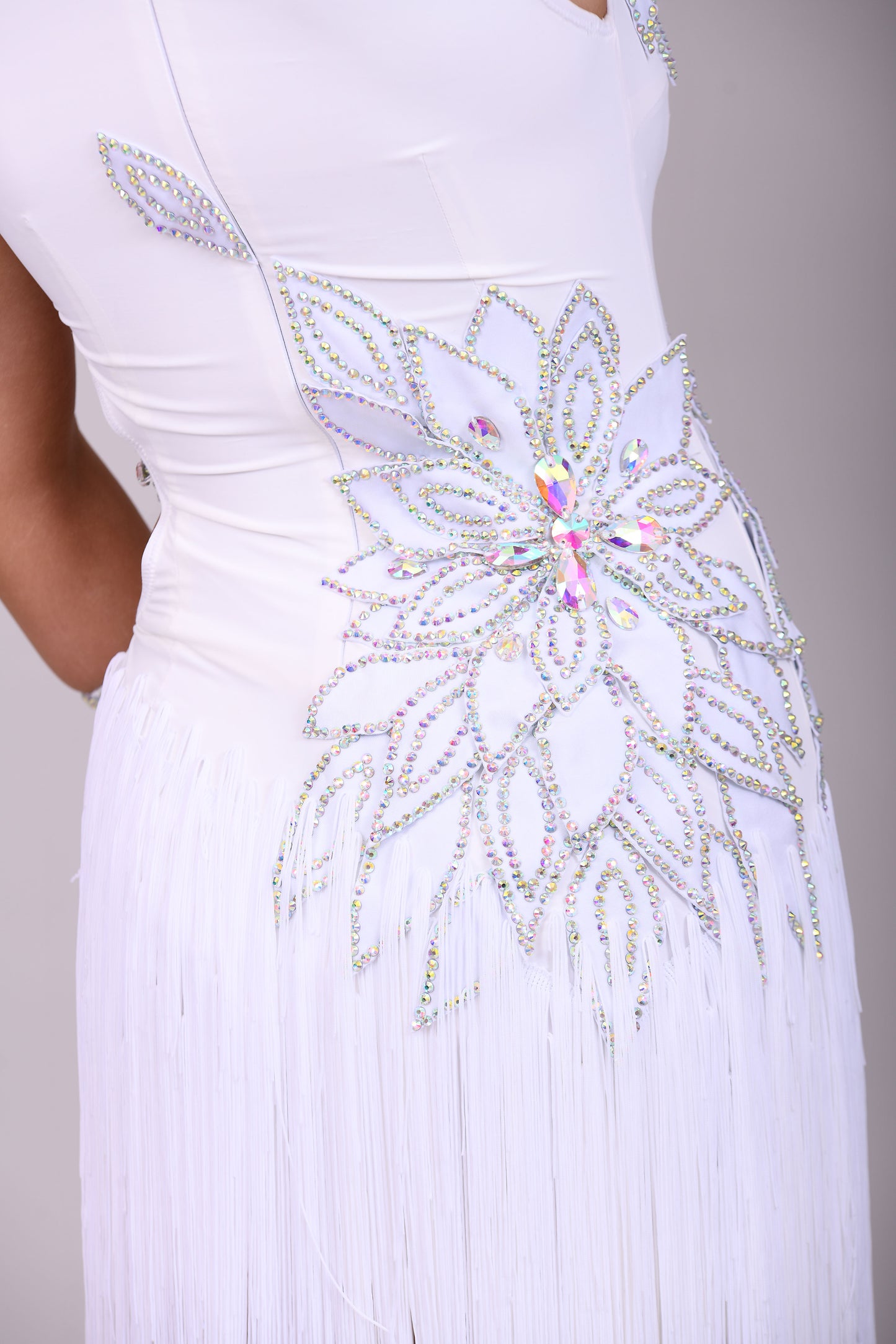 177 White 3D flower & leaf design Latin dress. Fringe skirt with open side detail. Stones all AB