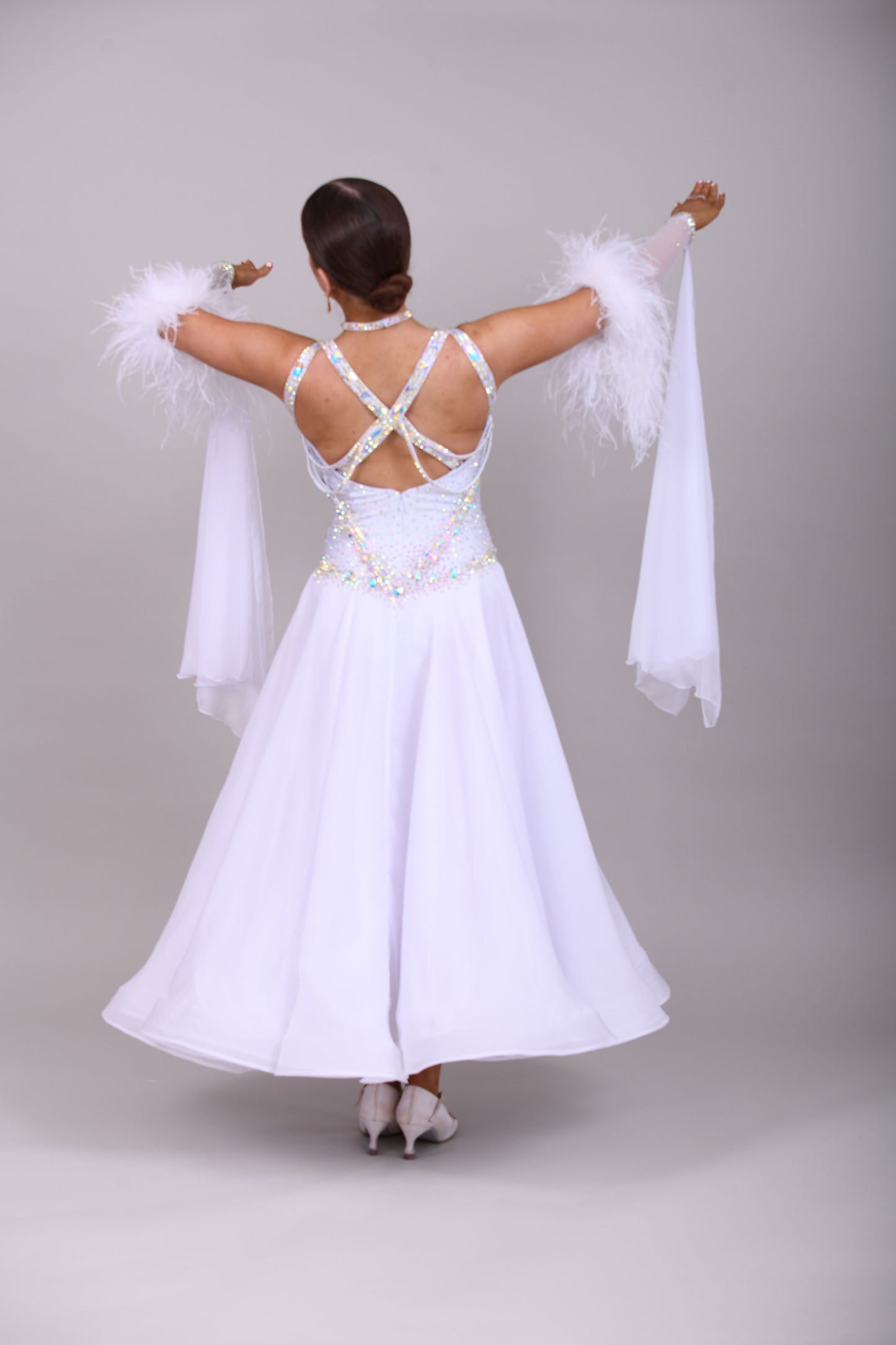 013 White Competition Ballroom/Sequence Dance Dress. Striking detailing to both the front & Back. Stoned in AB and sunshine. Cones with gloves, floats & Ostrich Boa cuffs.