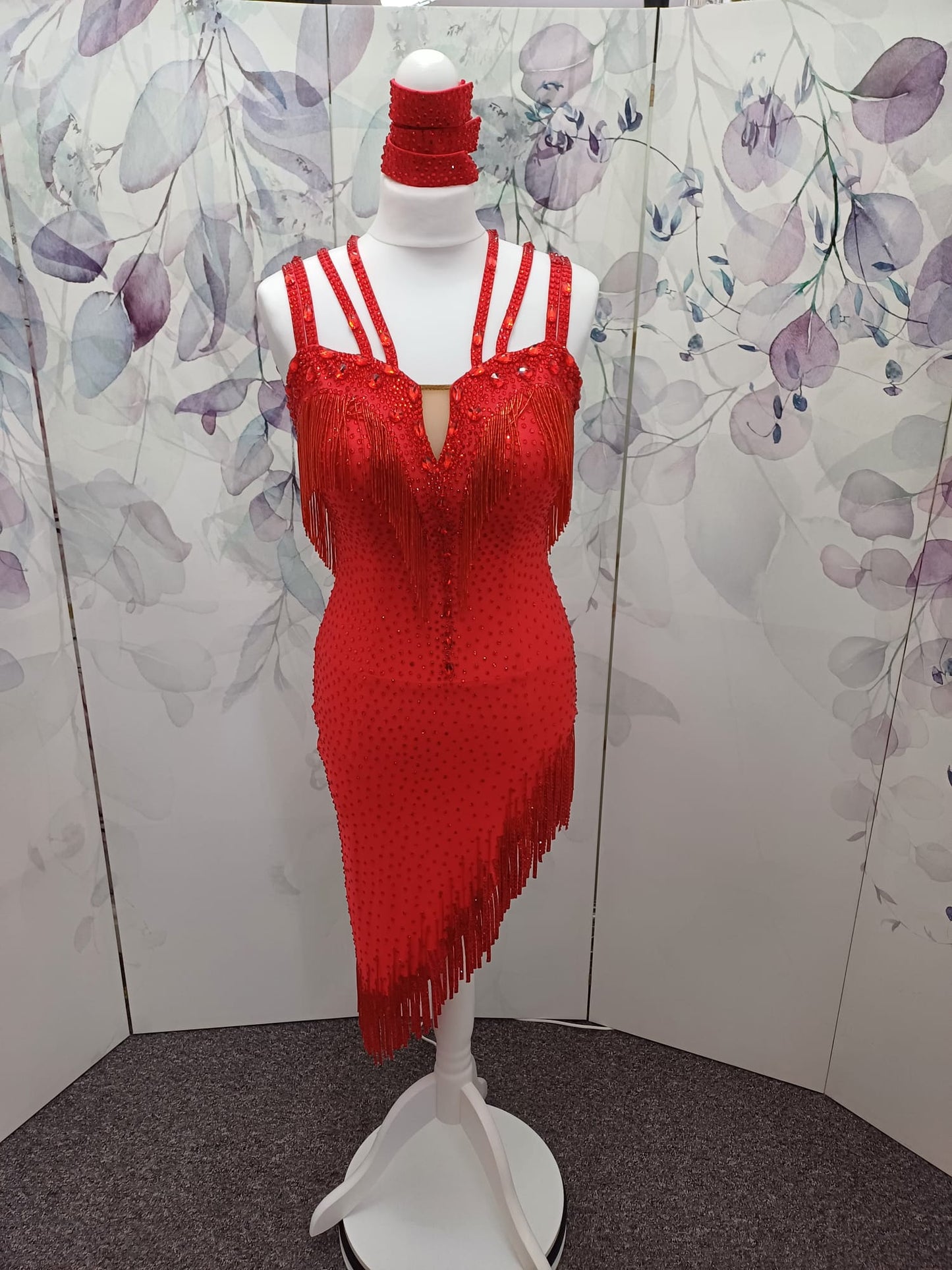 41L Red Latin Competition Dance Dress. Stoned in light Siam with strapping feature to the back & front. Bead droppers added to the hem for movement & upper chest.