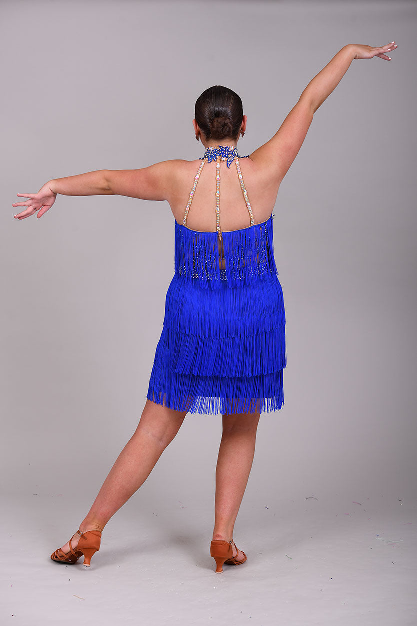 221 Bright Royal Blue Fringed Leotard & separate fringe skirt. Appliqué detailing to the waistband & Collar with flesh Lycra panels to the sides decorated in appliqué. All stones are AB & Sapphire.