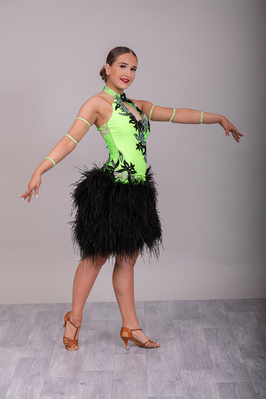 343 Flo Green & Black Latin Dress with keyhole halter neck detail. Strapping design to the back. Full ostrich feather skirt. Decorated with black motifs & stoned in Het AB & AB Boa is hand stitched so could be rearranged