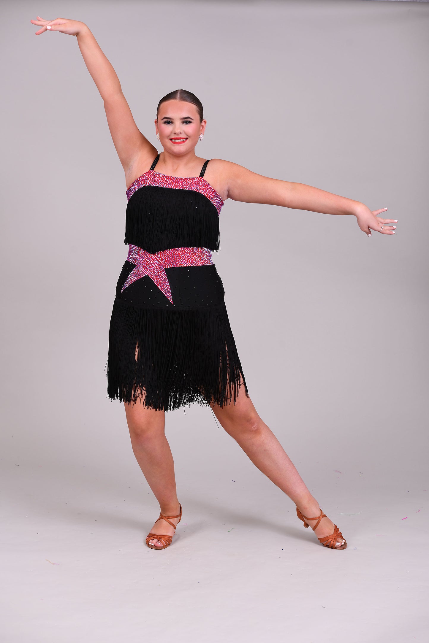 152 Black Latin Dress with full fringe skirt and fringe detailing to the bodice.  Cerise Belt and upper chest panels decorated in Siam AB stones