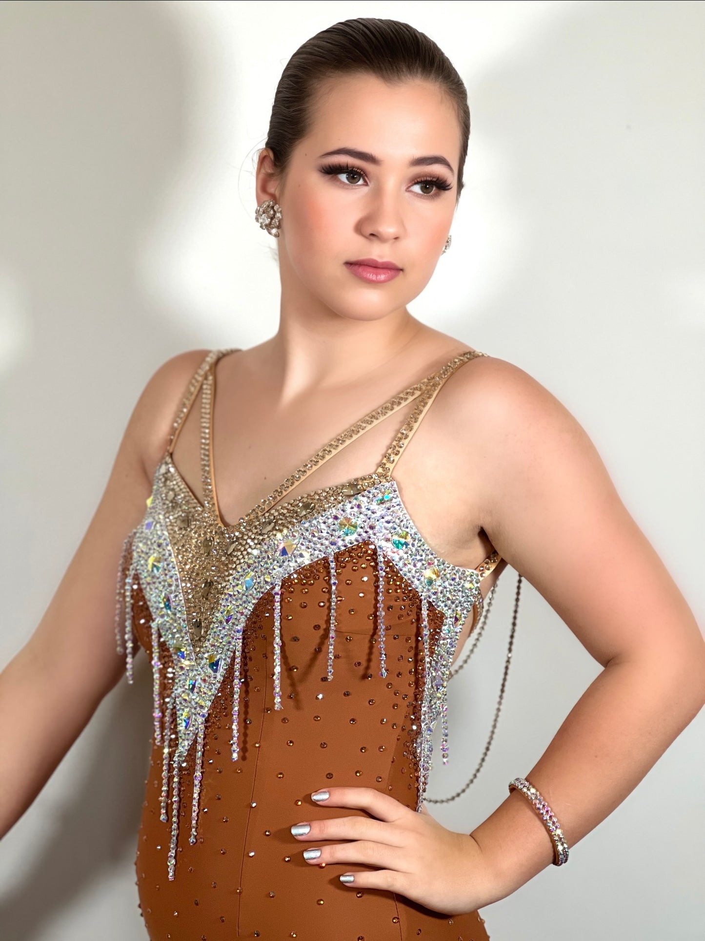 246 Cappuccino Ballroom Dress. Comes with Gloves & detachable glove floats. Stoned in Aurum, Sunshine, Smoked Topaz & Topaz. Strap feature to the back & shoulders