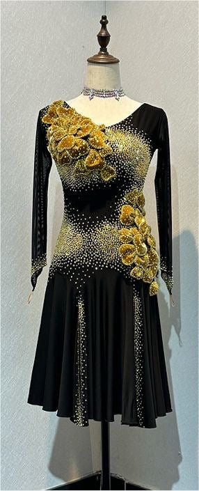 44L Black & Gold Competition Latin Dance Dress. Heavily stoned with 3D Detailing to the Hip & Chest. 2 Front Splits for extra movement. Showroom Appointments Available❤️