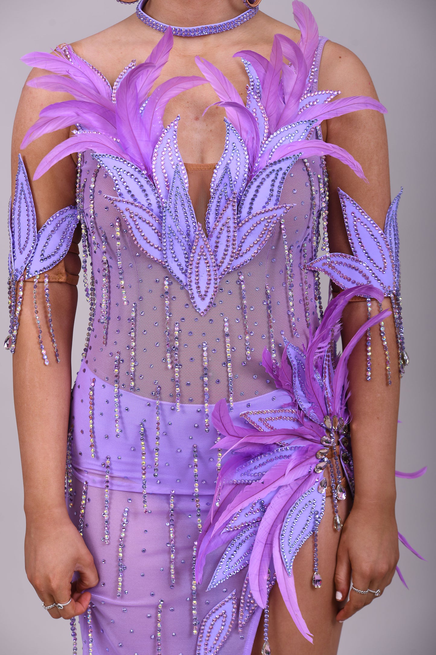 160 Lilac Latin dance dress. Stunning feather detailing to the upper chest & hip. Mesh fabric dress.