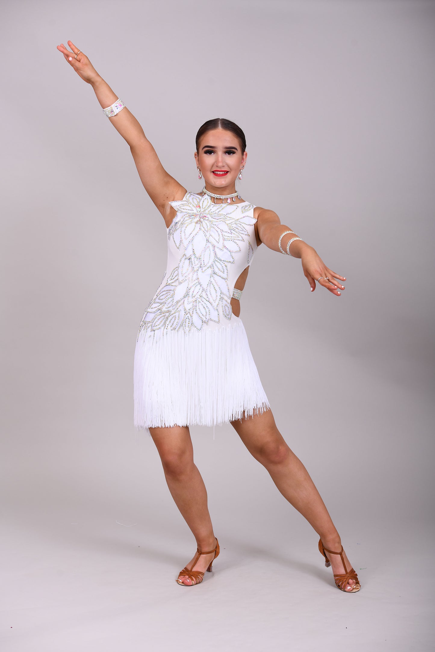 177 White 3D flower & leaf design Latin dress. Fringe skirt with open side detail. Stones all AB