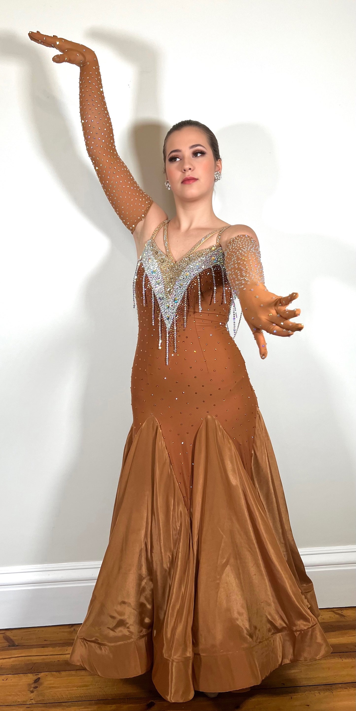 246 Cappuccino Ballroom Dress. Comes with Gloves & detachable glove floats. Stoned in Aurum, Sunshine, Smoked Topaz & Topaz. Strap feature to the back & shoulders