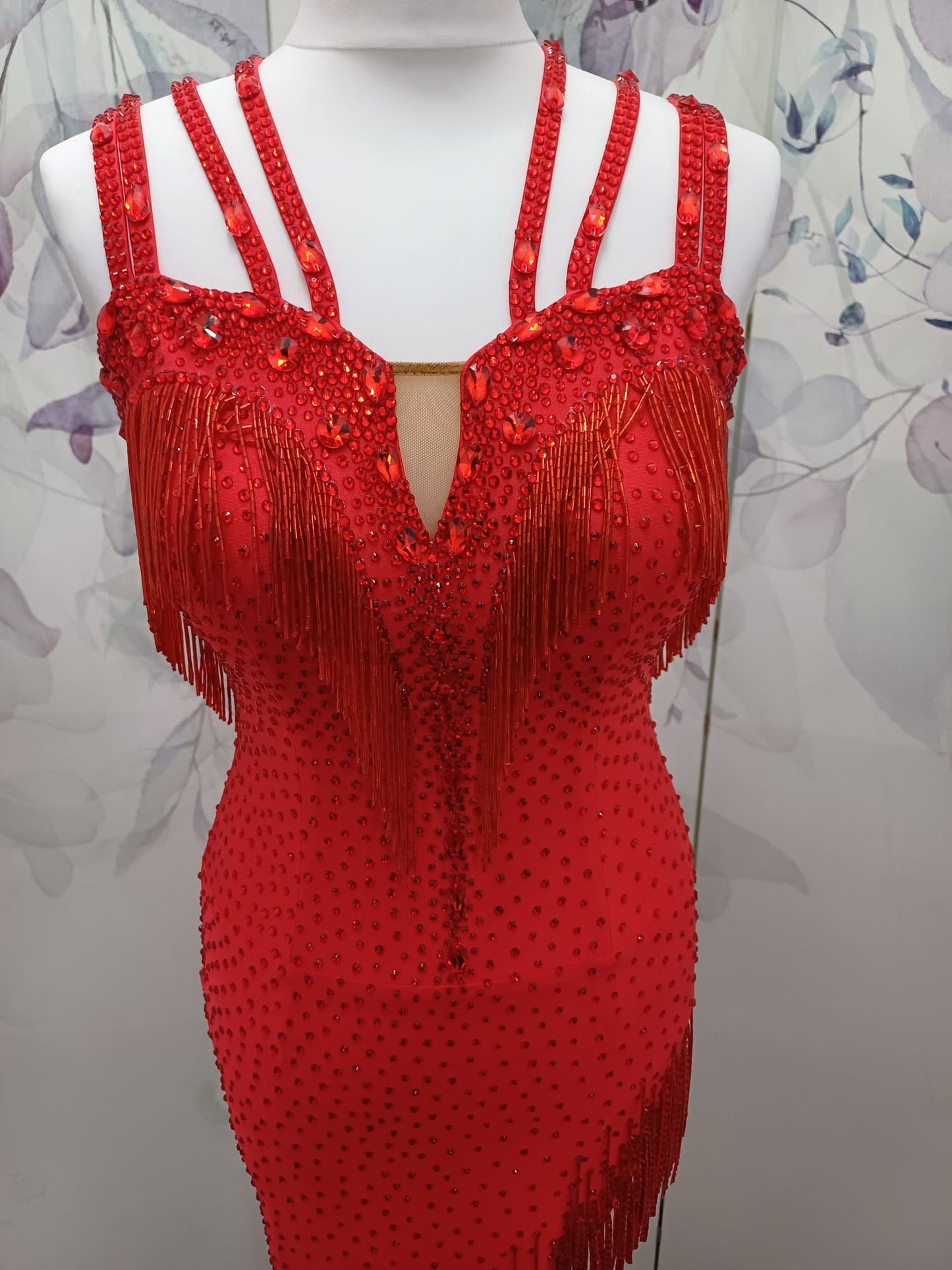 41L Red Latin Competition Dance Dress. Stoned in light Siam with strapping feature to the back & front. Bead droppers added to the hem for movement & upper chest.