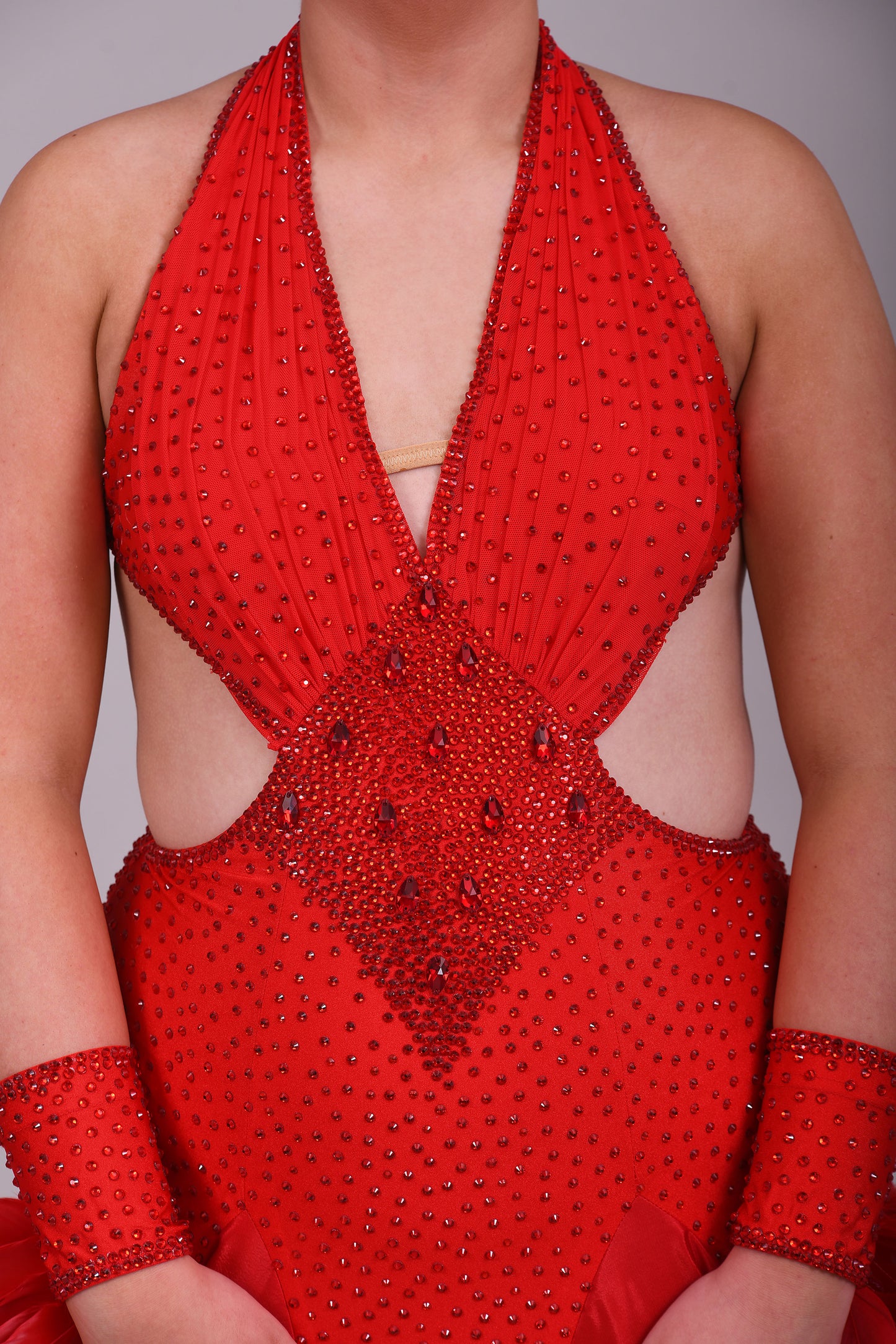 219 Red Sleeveless/Backless Ballroom/Smooth halter neck Dress. Feature panelling to the waist. Long Glove let’s with feather detailing. Flesh strapping to the chest and back.