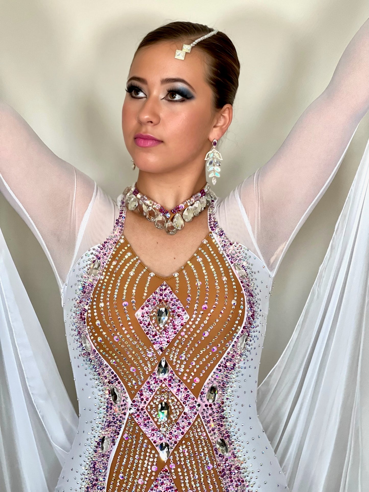 247 White and Tan Ballroom Dress. Stunning decoration stoned in AB & light rose. Floats to sleeves & back.