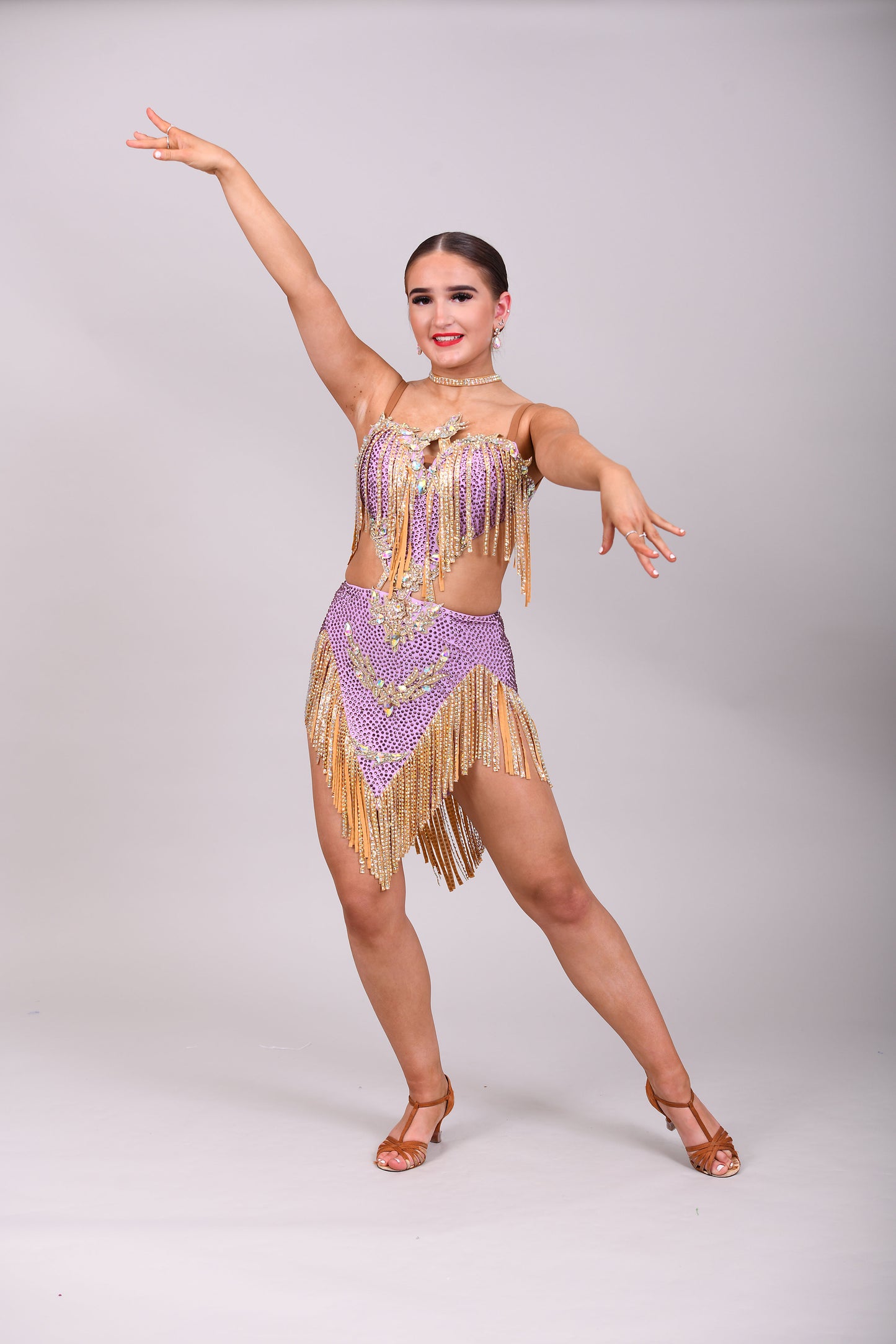 295 Lilac and Gold Latin dress. Gold material droppers stoned in AB. Lilac fabrics all decorated in matching stones.