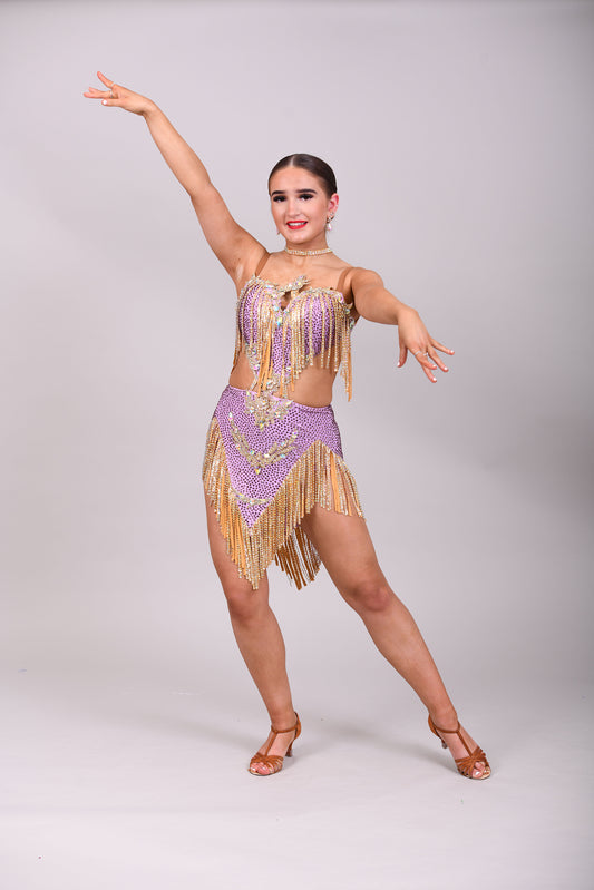 295 Lilac and Gold Latin dress. Gold material droppers stoned in AB. Lilac fabrics all decorated in matching stones.