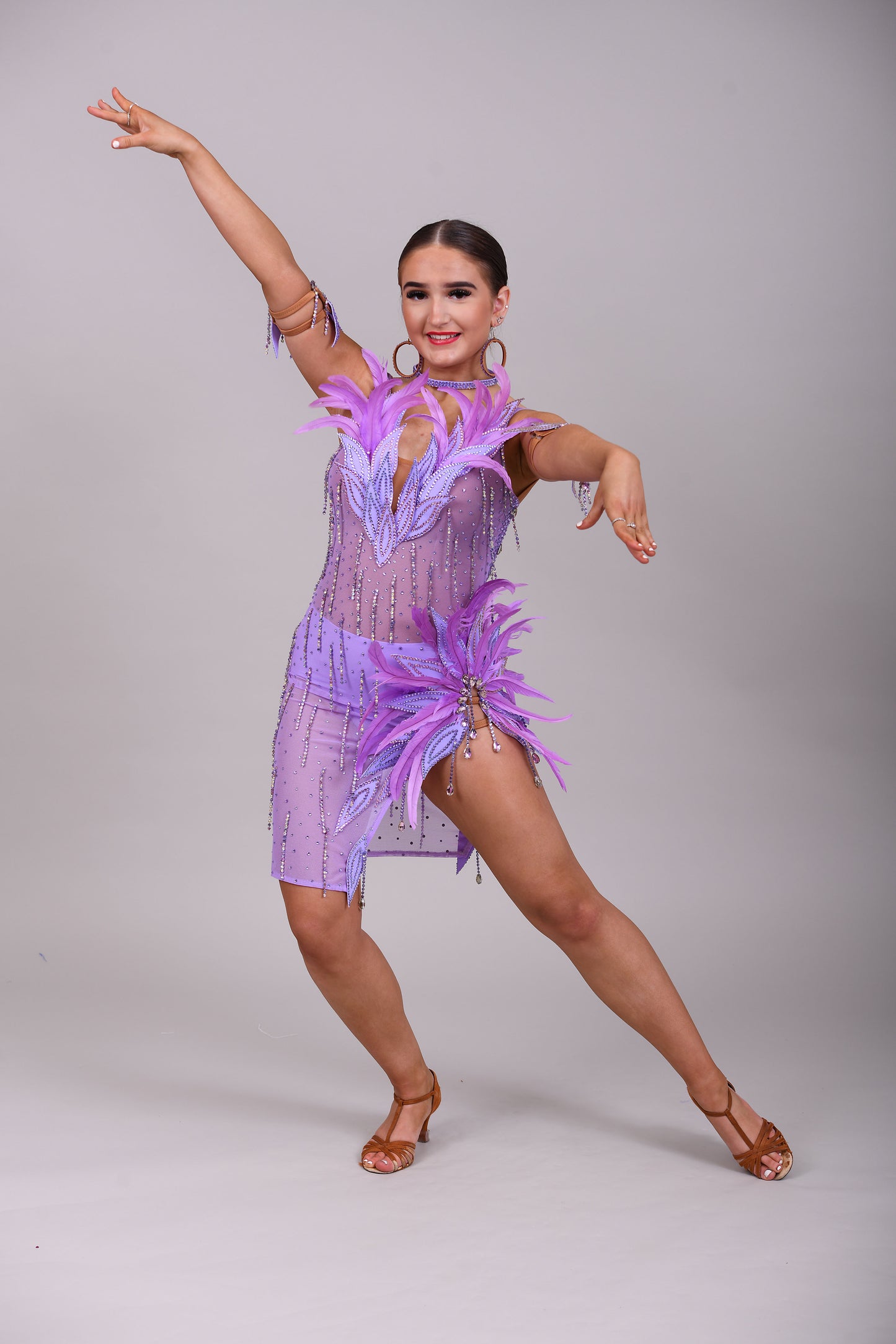 160 Lilac Latin dance dress. Stunning feather detailing to the upper chest & hip. Mesh fabric dress.