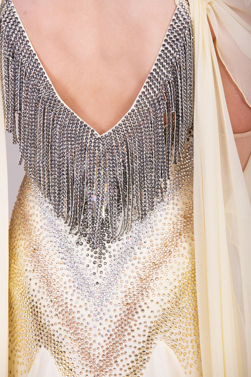 38B TWD PETITE Lemon & Silver Competition Ballroom/Sequence Dress
Stunning Flower detailing to the arm sleeve floats with 
Heavily stoned fabric droppers on the back. Very unusual neck/Shoulder