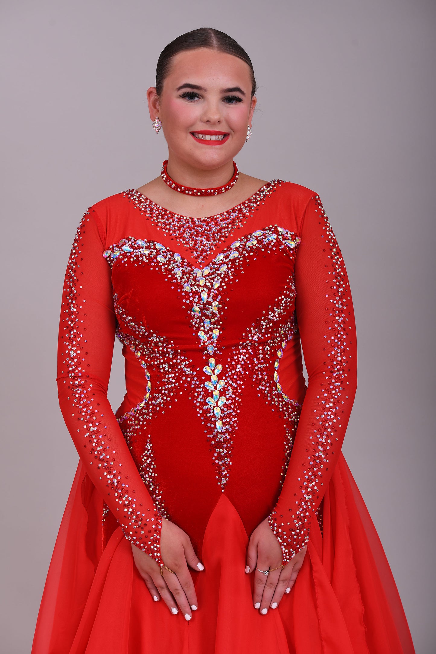 055 Red Competition Ballroom Dance Dress. Red Velvet Panels to the bodice. Heavily decorated in Siam & AB