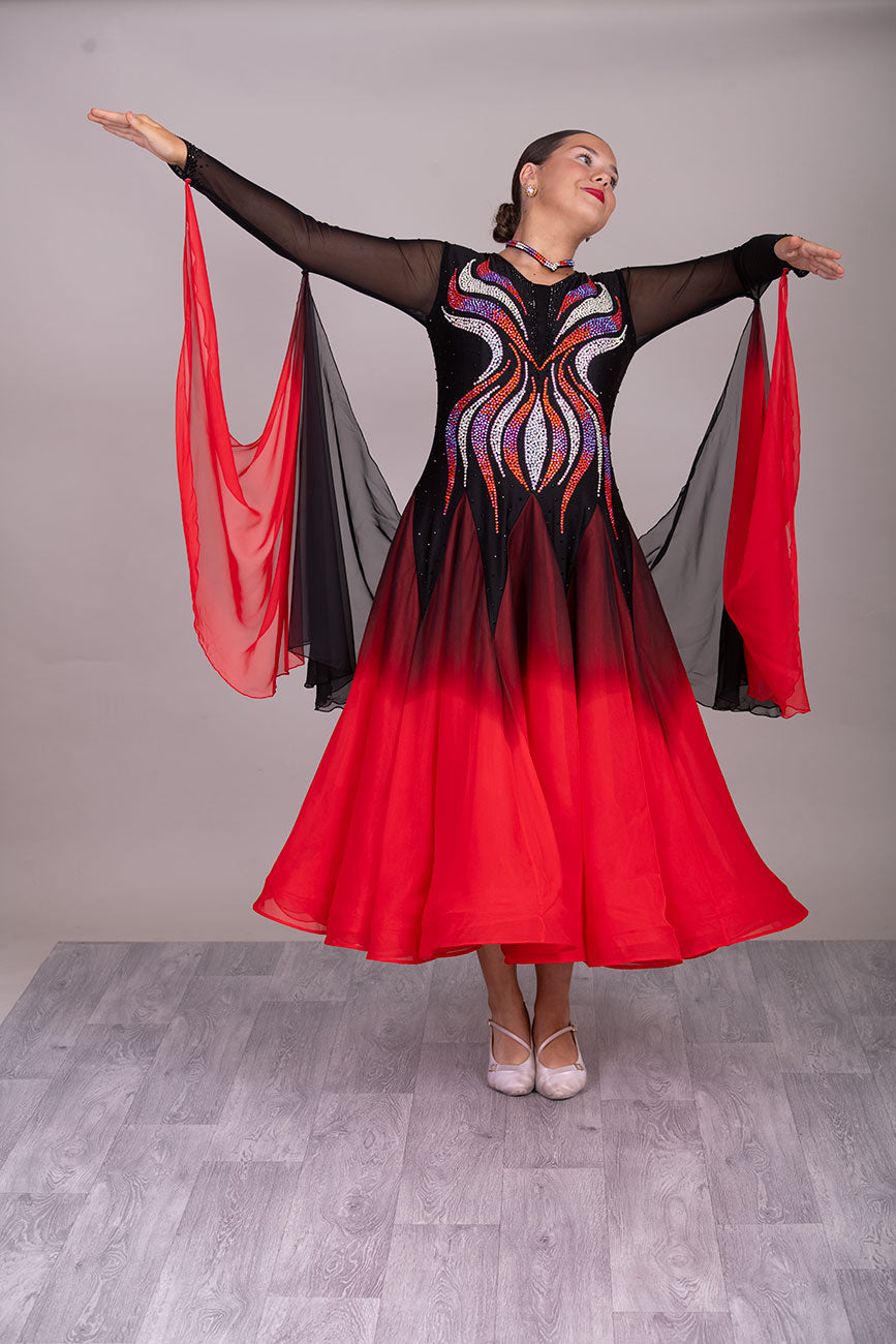 39B Red Black & Orange Ombre Competition Ballroom/Sequence Dance Dress. Ombre stoning in Oranges through to AB. Black & Red Ombre skirts with full back coverage. Detachable Floats complete this beautiful dress