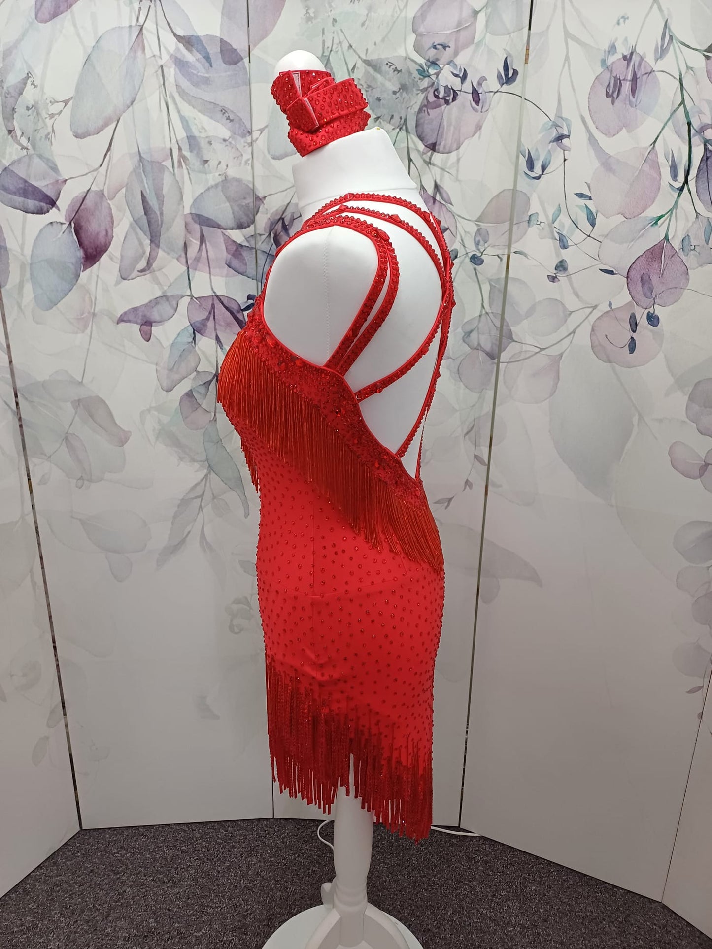 41L Red Latin Competition Dance Dress. Stoned in light Siam with strapping feature to the back & front. Bead droppers added to the hem for movement & upper chest.